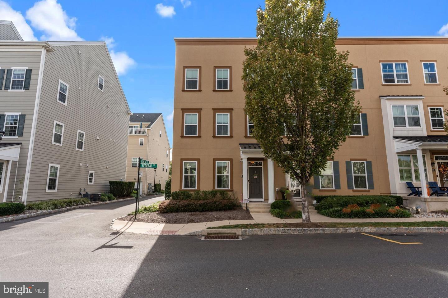 Welcome to luxury living in the highly sought-after Waterside community! This beautiful end-unit townhome offers the perfect blend of style, comfort, and convenience in one of Bucks County's most desirable riverfront neighborhoods. Enjoy the charm of walkable living with a neighborhood café, scenic Delaware River walking trails, parks, shopping, dining, and easy access to major highways and rail service.
Filled with natural light, this move-in-ready home features a versatile first-floor bonus room perfect for a home office, playroom, gym, or fourth bedroom, along with a spacious two-car garage. The open-concept main level showcases a beautifully appointed kitchen with granite countertops, stainless steel appliances, rich wood cabinetry, a large center island, and seamless flow into the spacious family room. Step outside to the composite deck with an electric awning—perfect for relaxing or entertaining. Upstairs, the spacious primary suite offers a walk-in closet and private bath with a double vanity and glass-enclosed shower. Two additional bedrooms, a full hall bath, and second-floor laundry complete the upper level.  Bonus Opportunity: The seller is also offering one of only six detached garages in the entire Waterside community for $45,000. Perfect for additional parking, storage, or a collector vehicle, this is a rare opportunity that seldom becomes available. The current list price reflects the home only and does not include the detached garage (Parcel #02-064-139C322, 144B Federal Street).