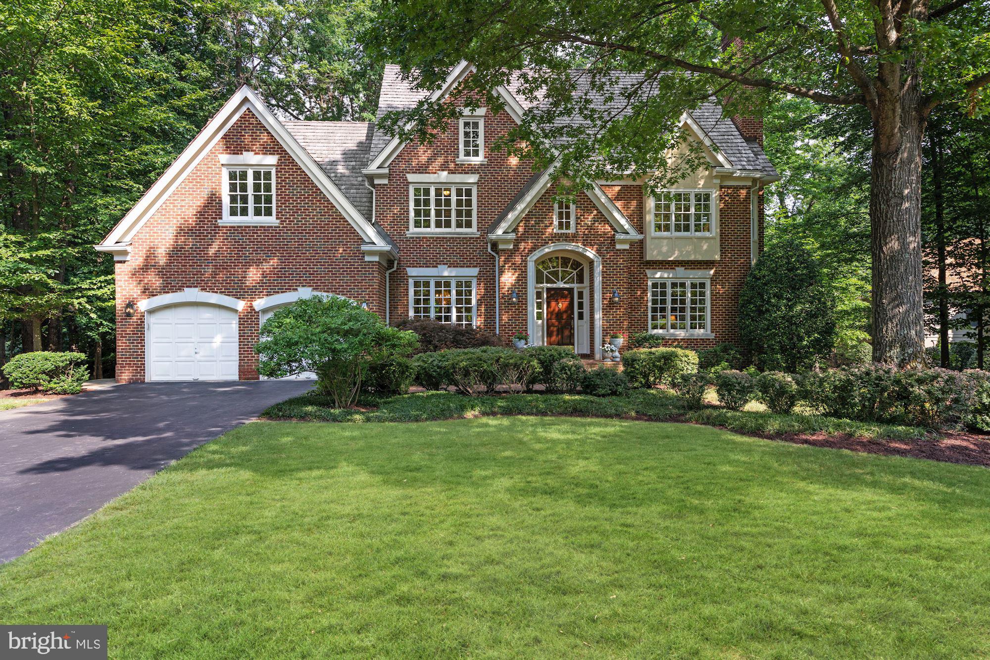 Stunning brick colonial in the prestigious Avenel community. Situated on a lush .65 acre private lot this home features over 5,000 square feet of living space with 5 bedrooms and 4.5 bathrooms with an attached 2 car garage. The main level features a grand 2 story foyer with hardwood flooring throughout. Off the foyer is the formal living room with cozy wood burning fireplace and tons of natural light. Entertain in style in the formal dining room with custom mill work and tray ceiling details. The gourmet eat-in kitchen features top of the line stainless steel GE Monogram appliances, granite counters, and a breakfast bar. You also have double ovens and an additional prep sink within the island. Off the eat-in area you have a built-in bar with wine rack and a built in work station. The sunny morning room is just off the kitchen with atrium windows, skylights, and leads out to the huge back deck overlooking the trees and yard. The main level also includes a private office with deck access and a family room with a stone gas fireplace. The upper level includes 5 spacious bedrooms and 3 bathrooms. The master bedroom retreat features another wood burning fireplace, tray ceiling detail, and walk-in closet. The master ensuite bath features a vanity with double sinks, a soaking tub, and a large tile shower. The lower level includes additional rec space with a stone fireplace, full bath, and tons of storage space. You also have a walk-out to your large stone patio and backyard with a built in basketball court. Ideally located within minutes to major commuter routes, shopping, and restaurants. Desirable location for both public and private schools. Living within the Avenel community includes many benefits such as a private Clubhouse, 3 pools, and 6 tennis courts. The Avenel Park is also located within the community with playgrounds, basketball courts, and jogging/walking paths. For equestrian lovers there is also a privately owned horse stable and riding facility. To top it off TPC Potomac at Avenel Farm has a PGA acclaimed 18 hole private golf course and club. Don't miss the opportunity to live in this luxury residential neighborhood. Virtual tour available at www.Darthomes.com.