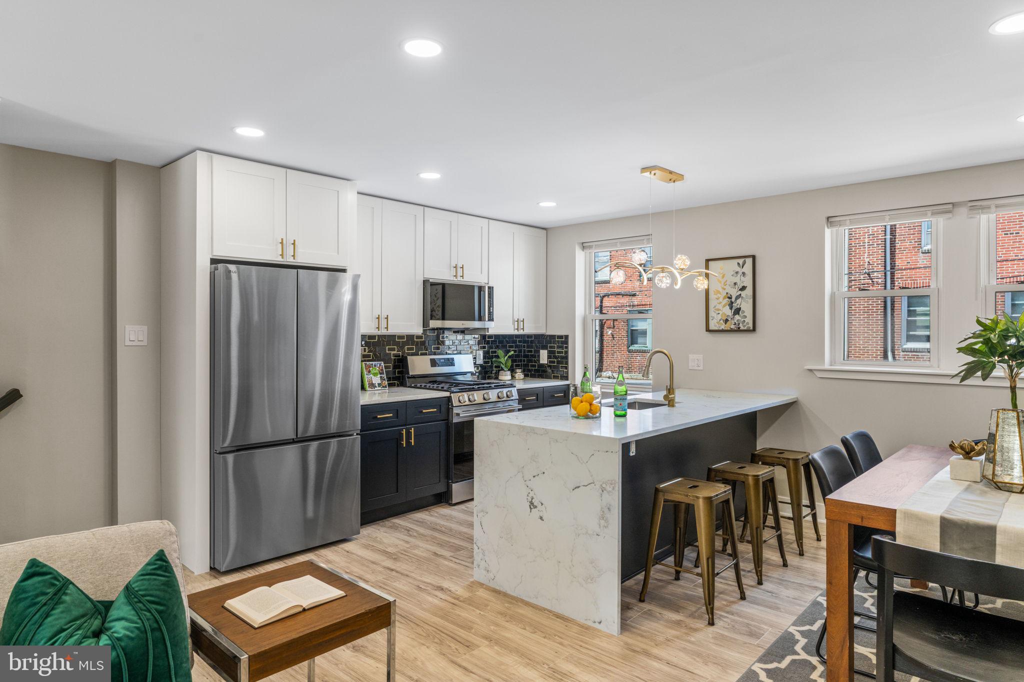 Welcome to this fully renovated home in desirable Northeast Philadelphia, just minutes from Pennypack Park. Featuring 4 bedrooms and 2 full bathrooms, this move-in-ready home has been thoughtfully renovated throughout and combines modern upgrades with comfort and functionality.

As you enter, you're welcomed by a bright open-concept layout connecting the living room, dining area, and kitchen. The kitchen features quartz countertops, custom cabinetry, brand-new stainless steel appliances, and a striking waterfall center island with seating.

The second floor offers three spacious bedrooms and a full bathroom. The finished basement expands the living space with a fourth bedroom, a second full bathroom, laundry area, and an additional nook ideal for a small desk or workspace.
Step outside to your private fenced outdoor space, perfect for summer BBQs, outdoor dining, and entertaining family and friends. The property also features rear parking for one vehicle.

Major upgrades include a new roof, new HVAC system, brand-new appliances, and modern finishes throughout.
Conveniently located near shopping, dining, schools, public transportation, and major commuter routes.

Don’t miss the opportunity to own a beautifully upgraded home with plenty of space for family and friends!