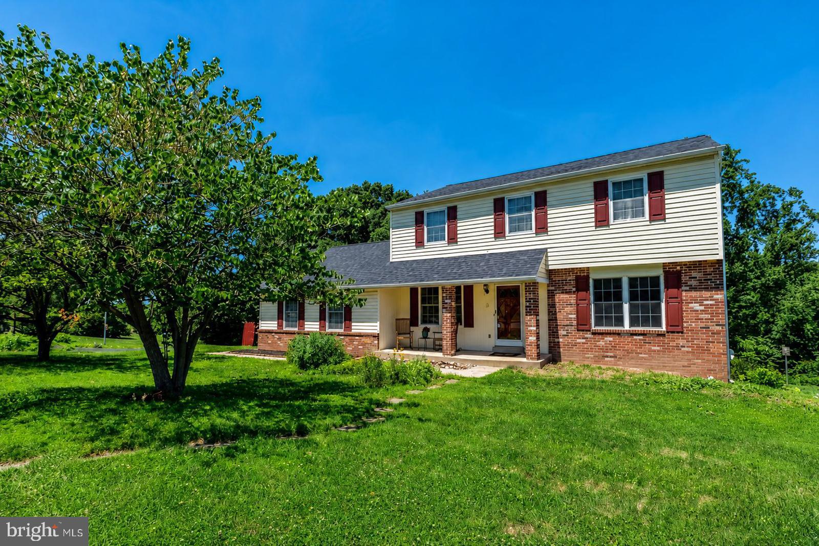 Welcome to this spacious home tucked away in the desirable Mingo community, located within the highly sought-after Spring-Ford School District. Situated on one of the largest lots in the neighborhood, this .67-acre property backs to mature trees, providing a private setting with plenty of outdoor space to enjoy.  The exterior features attractive brick accents, a welcoming covered front porch, a covered rear patio, and an attached two-car garage. The backyard offers a peaceful backdrop, making it an ideal place to relax or entertain.  Inside, you'll find a traditional floor plan with hardwood flooring throughout most of the first level. The home offers a generously sized formal living room and formal dining room, providing plenty of space for everyday living and entertaining. The eat-in kitchen features granite countertops, tile flooring, electric cooking, and a built-in microwave, and opens to the family room. A wood-burning fireplace with a brick surround creates a cozy focal point, while a door leads directly to the covered patio and backyard.  The second floor includes four comfortably sized bedrooms with ample closet space. The owner's suite features a walk-in closet, ceiling fan, and private bath with shower stall. The hall bathroom has been updated with marble tiles, tile flooring, and a tub/shower combination.  The unfinished walk-out basement, complete with a daylight window, offers excellent potential for future finished living space, whether you're envisioning a recreation room, home office, fitness area, or additional family room.  Offering solid living space, desirable features, a premium lot, and an outstanding location, this home presents a wonderful opportunity to personalize and make it your own in one of the area's most popular neighborhoods.