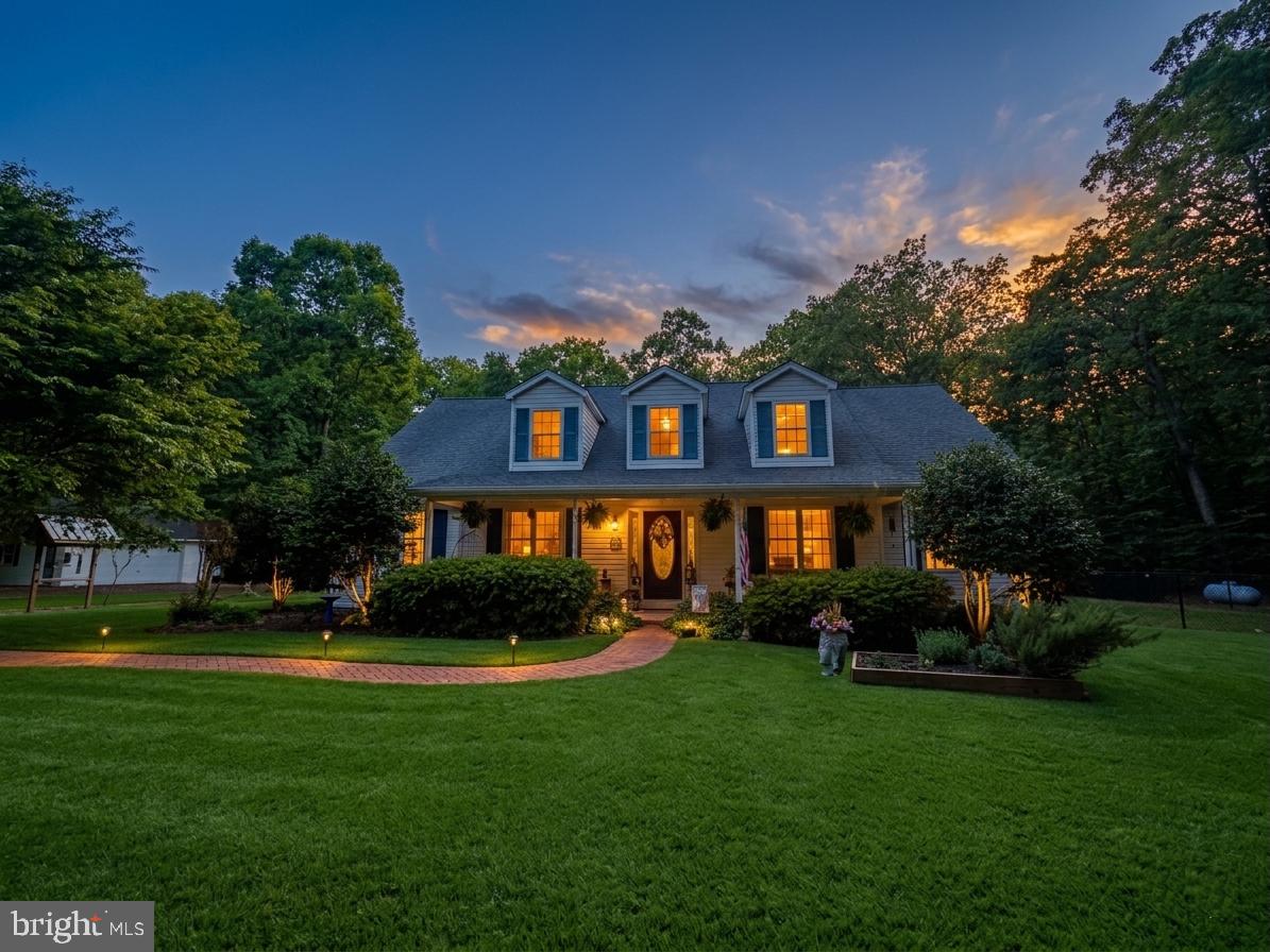 Welcome to a rare offering in the heart of historic Newburg, Maryland.  Where timeless Southern charm, peaceful countryside living, and thoughtful craftsmanship come together in perfect harmony. Offered for sale for the very first time, this custom-built residence is far more than a home; it is a place filled with intention, tradition, and treasured memories. So beloved was the floor plan by the current owners, they chose to build it twice.  A true testament to the home’s warmth, functionality, and enduring design.

Privately tucked away on approximately 3.5 secluded acres, this remarkable property is accessed by a private drive and surrounded by picturesque farmland, creating a setting that feels worlds away from the pace of everyday life. From the moment you arrive, the home welcomes you with the kind of understated elegance reminiscent of a Southern Living Magazine countryside retreat.   Inviting front porch, sweet tea afternoons, and tranquil views included, you’ll only need to bring your rocking chairs.

Inside, meticulous care and pride of ownership are evident in every inch of the home. Rich Brazilian cherry hardwood floors add warmth and sophistication throughout the main living areas, while oversized windows and dormers invite beautiful natural light into the home. The spacious main-level primary suite offers comfort and privacy, complete with an expansive en-suite bath featuring a jetted soaking tub, separate closets, and generous storage.

Designed with both entertaining and everyday comfort in mind, the home features a large living room centered around a cozy fireplace, creating the perfect gathering space for family and friends. Just beyond, the three-season sunroom overlooks the peaceful rear yard and offers a quiet escape to enjoy every season of Southern Maryland’s beauty.

The gourmet kitchen is ready for its next chef, appointed with granite countertops, stainless steel appliances, and a gas range that anchors the heart of the home with both style and function.

Upstairs, discover an expansive family recreation room or potential fourth bedroom complete with a full bath, upgraded plush carpeting and padding, ample storage, and charming dormers that bathe the space in natural light. Whether used as a guest retreat, media room, or private suite, the possibilities are endless.

Additional highlights include a recently updated heating system, fenced rear yard for your furry companions, garden areas, chicken coop space, detached garage and the kind of privacy that has become increasingly difficult to find.

Steeped in the quiet charm and rich history of Newburg — a treasured waterfront and farming community known for its scenic beauty and slower pace of life…this property offers the rare opportunity to own a true countryside retreat while still remaining conveniently accessible to modern amenities.
If you have been searching for a home with soul, substance, and a story to tell, this is the one you have been waiting for.