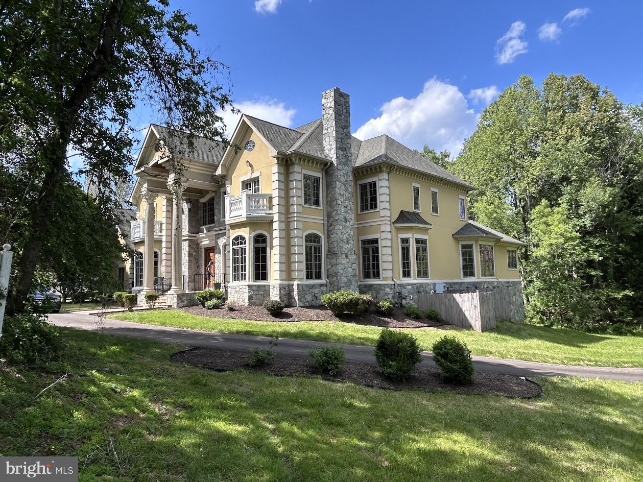 Welcome to an exceptional Great Falls estate offering over 10,000 square feet of refined living across three fully finished levels — a rare opportunity to own one of the most generously appointed properties in the 22066 zip code. Built in 2007 and professionally updated, this move-in-ready residence sits well back from the street on 3.5 private acres, delivering the seclusion and serenity that define Great Falls luxury living.
Inside, the home impresses at every turn. Seven bedrooms and ten bathrooms accommodate family and guests with ease, while seven fireplaces lend warmth and character throughout. The gourmet kitchen is a chef's showcase, featuring a six-burner gas range, wall ovens, a large center island, upgraded countertops, and a breakfast area — all flowing seamlessly into formal and informal dining spaces. Rich hardwood floors, soaring ceilings, and an entry-level bedroom round out the main level's thoughtful layout.
The fully finished lower level expands your entertainment possibilities with additional recreation and living space, plus walkout access. Outside, a private pool anchors the rear of the property — your own resort-style retreat surrounded by nature.
The attached garage accommodates multiple vehicles, and the home's systems have been professionally maintained throughout ownership. Located in the sought-after Beach Mill Downs neighborhood within Langley School District, and just minutes from Georgetown Pike, Tysons Corner, and the Potomac River park.
A truly move-in-ready home at this scale and price point is rare in Great Falls — don't miss your opportunity.