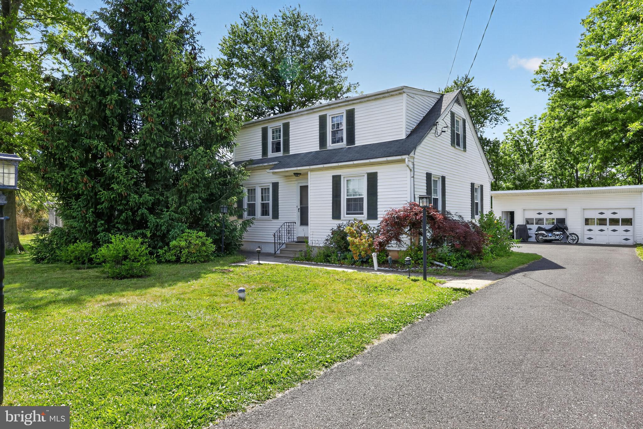 Welcome to 3438 E Orvilla Road, a 4-bedroom, 2-full-bath home in Hatfield, set in the sought-after North Penn School District. The flexible layout puts four bedrooms to work for family, guests, or a home office, with two full baths for everyday convenience. A standout feature is the massive detached 2-car garage with electric service, ideal as a powered workshop with room to park trucks and equipment. It's a rare find for contractors and small business owners who need real space to operate from home. The home offers solid bones and a chance to build sweat equity with your own updates. You're in a community known for its schools, parks, and easy access to Route 309, Lansdale, shopping, and commuter rail.