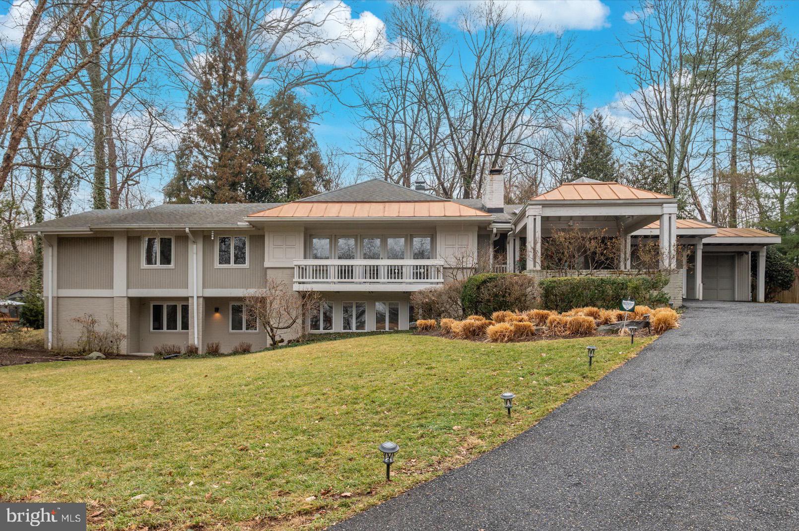 Offers, if any, due by 4pm Monday (3/9).  Tucked at the end of a quiet cul-de-sac on a well-manicured half acre lot with a heated pool, 7201 Selkirk is a Mid-Century stunner centrally located in the Whitman School District with easy access to the beltway and major commuter routes. Inside, offers ample storage, stunning floor-to-ceiling windows, and oversized rooms ideal for both everyday living and entertaining. The expansive formal living room, crowned by vaulted ceilings, opens directly to the back patio and features custom built-ins plus a tucked-away alcove—perfect for a play space, reading nook, or discreet home office. The eat-in kitchen is designed for gathering, with a center island, breakfast bar and wall of pantry storage. Just beyond, the family room echoes the home’s architectural drama with vaulted ceilings, built-ins, and seamless access to the patio for easy indoor-outdoor flow.

An elegant formal dining room with a fireplace and built-in buffet offers a more intimate setting and opens to a private balcony. The grand foyer makes a statement on arrival, complete with two coat closets and access to the oversized two-car garage, while a stylish powder room serves the main level. The main-floor primary suite is a true sanctuary, featuring its own entrance to the backyard, custom built-ins, two large walk-in closets, and an ensuite bath with dual vanities, a walk-in steam shower, and a soaking jacuzzi tub. An additional bedroom or office with a built-in desk and a hall bath—perfectly positioned as a pool bath with direct outdoor access and an adjoining laundry area for towels—complete the level.

Downstairs, the walk-out lower level offers a generous recreation room with fireplace and built-ins, two additional bedrooms, a full hall bath, and abundant storage, including a second laundry area. Out back, the home truly shines. The fenced yard offers multiple patios and an in-ground heated pool. Surrounded by mature trees and lush landscaping, the home is sited for exceptional privacy—an unexpected retreat just minutes from neighborhood parks, shops, and major commuter routes into downtown DC and Bethesda.