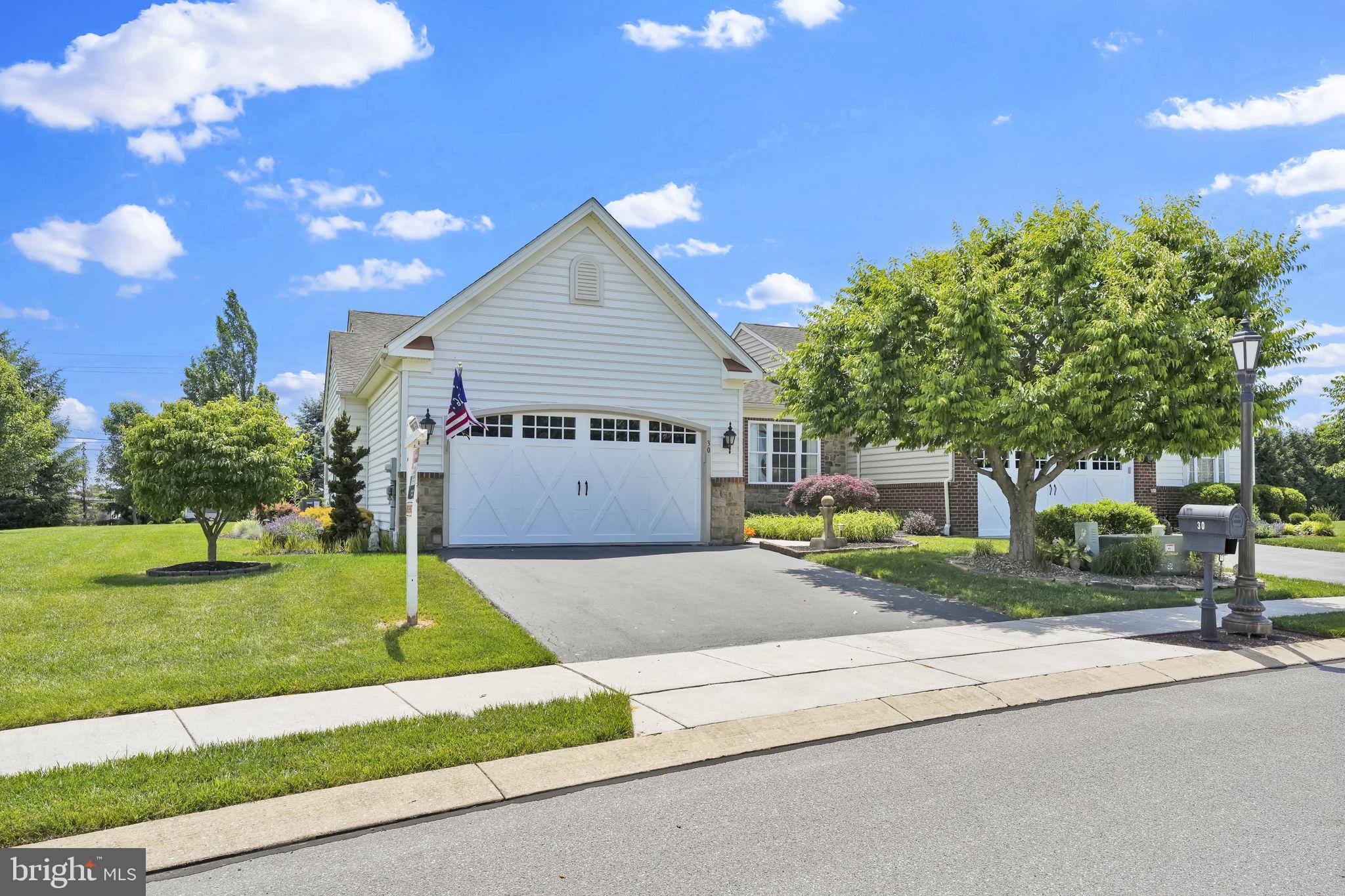 Stunning and magazine-worthy, this rarely offered home in Cattails is an exceptional find under $400K. Gleaming wood floors, custom window treatments that convey, and meticulous care throughout make this home truly move-in ready.  The seamless floor plan is designed for both comfort and entertaining, with the breakfast area opening to a covered deck that beautifully extends the living space outdoors. Enjoy peaceful mornings or relaxing evenings surrounded by nature, creating the feeling of an indoor-outdoor retreat.   Beyond its beauty and charm, this home also offers peace of mind with major updates already completed, including a new HVAC system, water heater, appliances, and sump pumps.   A magnificient kitchen offers updated appliances, space to prep, cook and entertain with a double pantry.  Two dining options, one at the front of the home is presently used as a living room and a generous breakfast area in the open floor plan of the center of the home.  Three true bedrooms, two full baths, laundry/mud room and storage in crawl space and garage.  This home is a must-see, move in ready gem looking for the next owner.