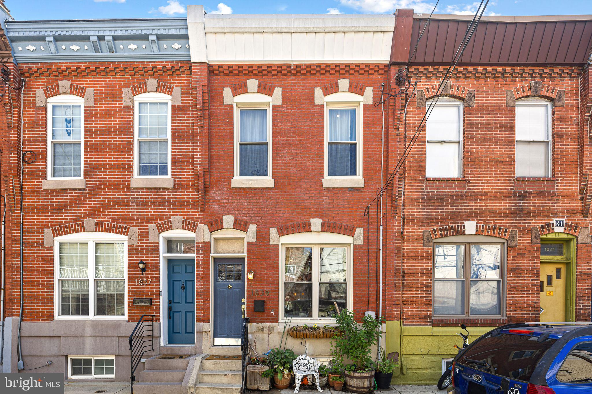 Showings begin at the Open House Saturday, July 11th, from 12pm-1pm. Steps from it all, but located on a quiet, no through traffic block, this impeccably maintained and updated home has warmth and character, combined with modern comforts. From the moment you approach the home, you can feel the charm radiate from its classic brick facade. Enter into the tile vestibule with custom-painted wall art. Step into the living room to find a sun-splashed living and dining area, with high ceilings with crown molding and designer-selected paint and accents throughout to complement each space. Find a powder room on this level, with a clair de lune blue ceramic sink, the first of two bathrooms. Renovated kitchen features a farmhouse sink with window overlooking a backyard with full sun for growing lush plants, a full suite of stainless steel appliances including a 5 burner gas range and a dishwasher, located in the space adding peninsula island, which also features a butcher block breakfast bar, adding additional seating for everyday convenience. Step outside to find your private backyard oasis - perfect for gardening, grilling and dining al fresco in the warmer months. Downstairs, find a finished basement with separate laundry area as well as a separate office space, also perfect for crafting or storage. This lower level offers a great space for additional living room/den or a guest area. Take the stairs to the second level to find the two well-proportioned bedrooms, each filled with natural light. The primary bedroom, which easily accommodates a large furniture set, features two closets and elegant crown molding. For additional storage, there is a large cedar closet off the hall to serve the second bedroom. The hall bathroom features a space saving barn door, and has an impressive custom built reclaimed wood vanity with dual sinks, tile shower and bathtub combination, and a large window. Central air completes this fantastic residence. Steps from Passyunk Ave, and less than 2 blocks walk to the nearest stop of the Broad Street Subway line, this house is perfect for enjoying all of the fantastic restaurants Passyunk Square and South Philadelphia have to offer, while also being a quick commute downtown to Center City, or to the stadiums to catch a game. Watts Street, located between Mifflin and Moore Streets, is not a through street, so there is never any traffic on this quiet, well maintained block, where residents find parking easily. In the acclaimed Fanny Jackson Coppin elementary school district, rated in the top 3 in Philadelphia. Truly a must see home!