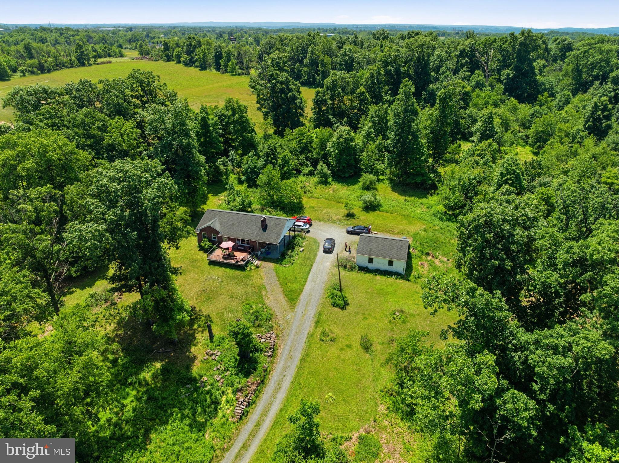 Live Public Real Estate Auction will be held on Thursday, July 16th at 7:00pm - Please note: price listed does not reflect the price the property will sell for at auction, it was added for listing and search purposes only.

 

Move right into this well-maintained 3-bedroom, 2-bath home situated on a secluded 11.5-acre property in Pottstown, PA. Nestled in a scenic setting, this property offers the perfect balance of privacy and open space while remaining conveniently located just minutes from Route 422.

The home features a cozy fireplace, a convenient laundry chute, and a finished basement with a full bathroom, providing additional living and entertaining space. Modern amenities include a Tesla charging station for electric vehicle owners, while a detached two-car garage offers ample storage and parking.

10 Sheridan Ln presents a rare opportunity to own a significant acreage property in Montgomery County.

Please Note: The property is currently tenant-occupied with a monthly rent of $1,500. Under the terms of the existing lease, the tenant must be provided with 60 days' notice to vacate the property. The successful buyer may choose to negotiate a new lease agreement with the tenant or provide notice following the auction, initiating the 60-day vacate period. Settlement shall occur 60 days after the auction date.

 

This property is being offered as part of the estate of Mark McClelland. The sale is subject to the estate's confirmation.
