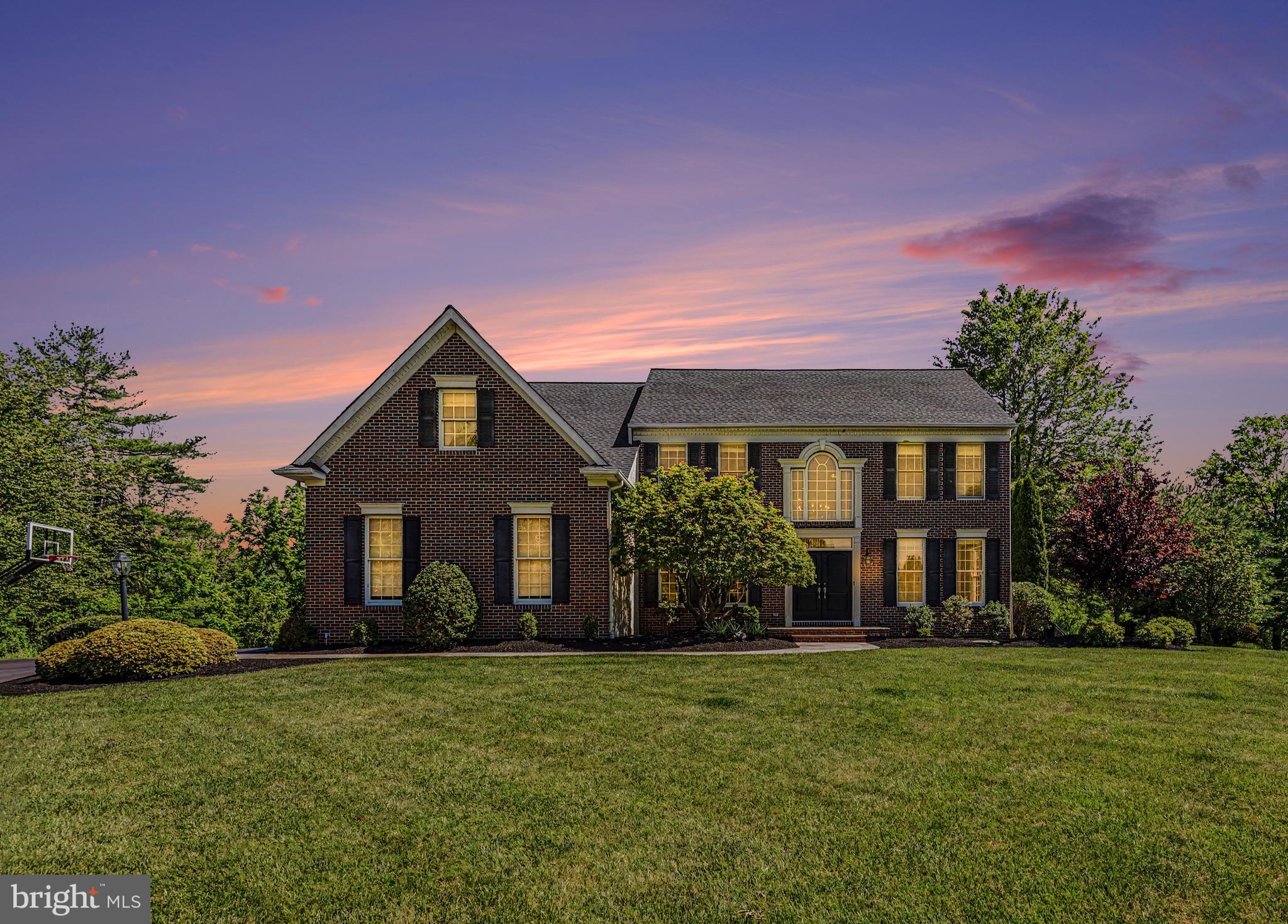 Welcome to 3780 Reagan Drive, located in the desirable Enclave at Evansburg community within Perkiomen Valley School District. Tucked into a cul-de-sac and backing up to Evansburg State Park, this beautifully updated home offers exceptional indoor and outdoor living. A stunning brick exterior, fresh landscaping, and brownstone walkway lead to double front doors opening into a grand foyer with vaulted ceilings and new white oak flooring found throughout much of the home.

The main level features a family room with shiplap accent walls, formal dining room with wainscoting, private office, powder room, and an open-concept layout ideal for everyday living and entertaining. The kitchen offers granite countertops, a center island, turquoise subway tile backsplash, abundant newly painted white cabinetry, breakfast area, and opens to the spacious living room. This living room features soaring ceilings, a gas fireplace, surround sound system, and copious natural light from Anderson windows found throughout the home.

Off the kitchen is a private laundry room with Samsung side-by-side washer and dryer, stone countertops, new vinyl plank flooring, and direct access to the oversized 3-car garage with newly installed garage door openers.

Upstairs you'll find 4 bedrooms and 2 full bathrooms, including the spacious primary suite featuring a custom walk-in closet with built-ins and a luxurious en-suite bath complete with radiant heated floors, new skylight, double vanity, clawfoot tub, and walk-in Roman shower. Owner is a Licensed Real Estate Agent.

The fully finished walkout basement adds valuable living space with a 5th bedroom featuring a walk-in closet plus a large recreational area offering endless flexibility.

Outside, enjoy your private backyard oasis overlooking Evansburg State Park featuring a heated in-ground pool with new equipment, Trex deck, private hot tub deck, stone gas fireplace, fire pit area, gazebo with built-in propane heater, and professional in-ground basketball hoop.

Additional highlights include Anderson windows throughout, surround sound, soft water and filtration system, new vinyl plank flooring in the mudroom, and a new roof on both the home and gazebo installed in 2025. A rare opportunity offering space, updates, and an incredible setting in one of the area's most desirable neighborhoods.
