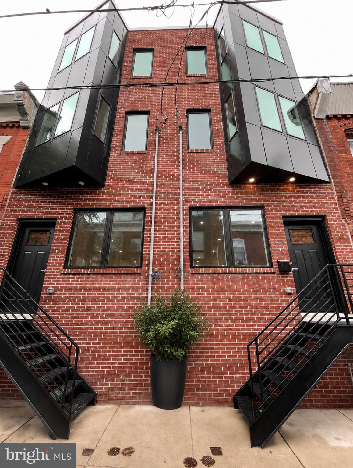 Introducing this stunning newly constructed residence built by one of Philadelphia’s premier boutique builders, renowned for meticulous craftsmanship, thoughtful design, and carefully curated finishes throughout. Welcome to 525 Sigel Street, a light-filled four-bedroom, three-full-bath home featuring soaring ceiling heights, a fully finished lower level, an incredible roof deck, and an exceptional open-concept layout.  From the striking all-brick façade with designer overhang lighting to the beautifully appointed interior spaces, every inch of this home reflects quality materials, sophisticated style, and intentional design. 



Inside, the main level features an expansive open floor plan highlighted by soaring ceilings, a large sun-filled front window, custom built-in shelving, and gorgeous 5-inch solid oak wide-plank hardwood floors throughout. The chef’s kitchen is truly the centerpiece of the home, showcasing an oversized breakfast island with designer pendant lighting, quartz countertops, designer tile backsplash, 42-inch cabinetry, built-in shelving, and a premium GE stainless steel appliance package. Double doors off the kitchen lead to a sizable private outdoor space complete with new fencing, perfect for entertaining or relaxing.



The second floor features two generously sized bedrooms with 9-foot ceilings, solid-oak hardwood flooring, and abundant natural light throughout. The sun-drenched front bedroom offers oversized south-facing windows, beautiful architectural lines, and excellent closet space. The rear bedroom enjoys double windows, impressive Center City views, and a full wall of closets. This level is completed by a spacious laundry room with gas, electric, and water hook-up only and a beautifully appointed hall bath featuring a double quartz vanity, designer ceramic tile surround, and tub.


Occupying the entire third floor, the primary suite is a true retreat. This expansive space offers high ceilings, a beautifully designed bedroom area, and an entire wall of custom built-in closets leading to a spectacular spa-like bath. The luxurious bathroom is filled with natural light and features breathtaking skyline views, a massive walk-in frameless glass shower, designer ceramic tilework surround, and a double quartz vanity, all finished with elegant design. Just outside the suite is a very convenient wet bar with quartz countertops, custom shelving, and wine refrigerator, perfectly positioned for easy access to the incredible roof deck.



The expansive roof deck offers breathtaking 360-degree panoramic views stretching from the Center City skyline to University City, Penn’s Landing, and the stadium district, creating one of the home’s most impressive entertaining spaces.



The fully finished lower level features excellent ceiling height, a beautifully appointed full bath with a frameless glass shower, mechanical room, and a versatile rear bonus room ideal as a fourth bedroom, guest suite, gym, or work-from-home office.  Additional highlights include a 10-year declining tax abatement and a full sprinkler system.

A truly special city home offering refined finishes, incredible outdoor space, panoramic skyline views, and a thoughtfully designed layout throughout. This is one you don't want to miss. Schedule your appointment today!