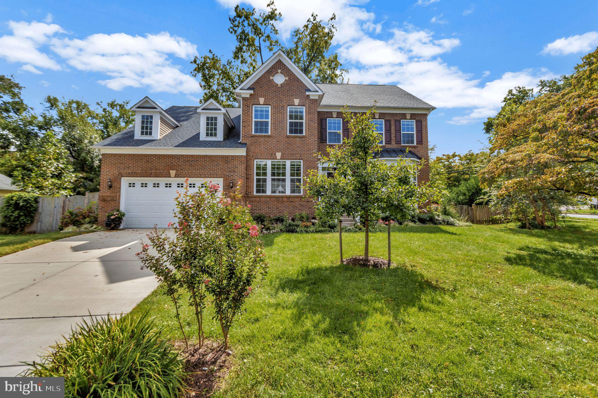 Be ready to call this home. Located in Falls Church City, this stunning custom build was completed in 2018 by renowned builder Stanley Martin. With over 6000 square feet of light-filled living space, 6 bedrooms and 5 1/2 bathrooms distributed over four floors, there is room for everyone in your family to find their work space, study space, entertainment area, or quiet space.
Gleaming hardwood covers the entire main floor, which includes a formal living room, office, dining room, mud room, kitchen, and more. The beautiful gourmet kitchen is appointed to satisfy the most avid cook and entertainer with stainless steel appliances, dark wood cabinetry, granite countertops, and an expansive center island. The kitchen opens up to the impressive family room with gas fireplace; the adjacent light-filled sun room with sliding doors opens up to a private stone patio and fenced yard. With Autumn just around the corner you will enjoy many evenings around a cozy bonfire.
Head to the upper level, home to a roomy laundry room with front load washer and dryer and four spacious bedrooms including the primary suite featuring an extra wide walk-in closet, private sitting room, and a luxurious bathroom with double vanity and spa tub.  A true private oasis.
The top level features an additional bedroom, full bathroom, and loft which makes it an ideal space for an in-law suite, an au pair or teenage fun.  The lower level is equipped with a newly installed wet bar, a large recreation room, one bedroom with full bath and additional space that can be turned into a great work out area.  The list of incredible upgrades will amaze you: an attached two car garage is already equipped with an EV-vehicle charger; solar panels will keep your electric bills to a minimum; and, a professionally installed rain garden (city tax credit available) and rain barrels will help collect water for your garden. Oh, did we mention how the central Vac system makes vacuuming a breeze?
This Fantastic Home has a great location and is zoned for Falls Church City School Pyramid to include the newly constructed Meridian High School. Enjoy all that the City of Falls Church has to offer from shops, restaurants, farmers market, and lots of activities, as well as the nearby Tysons and Mosaic District. Easy access to commuter routes, and two Metro stations are just minutes away. Anything you could envision in your ideal home takes life in this beautiful space, there is truly room for anyone!