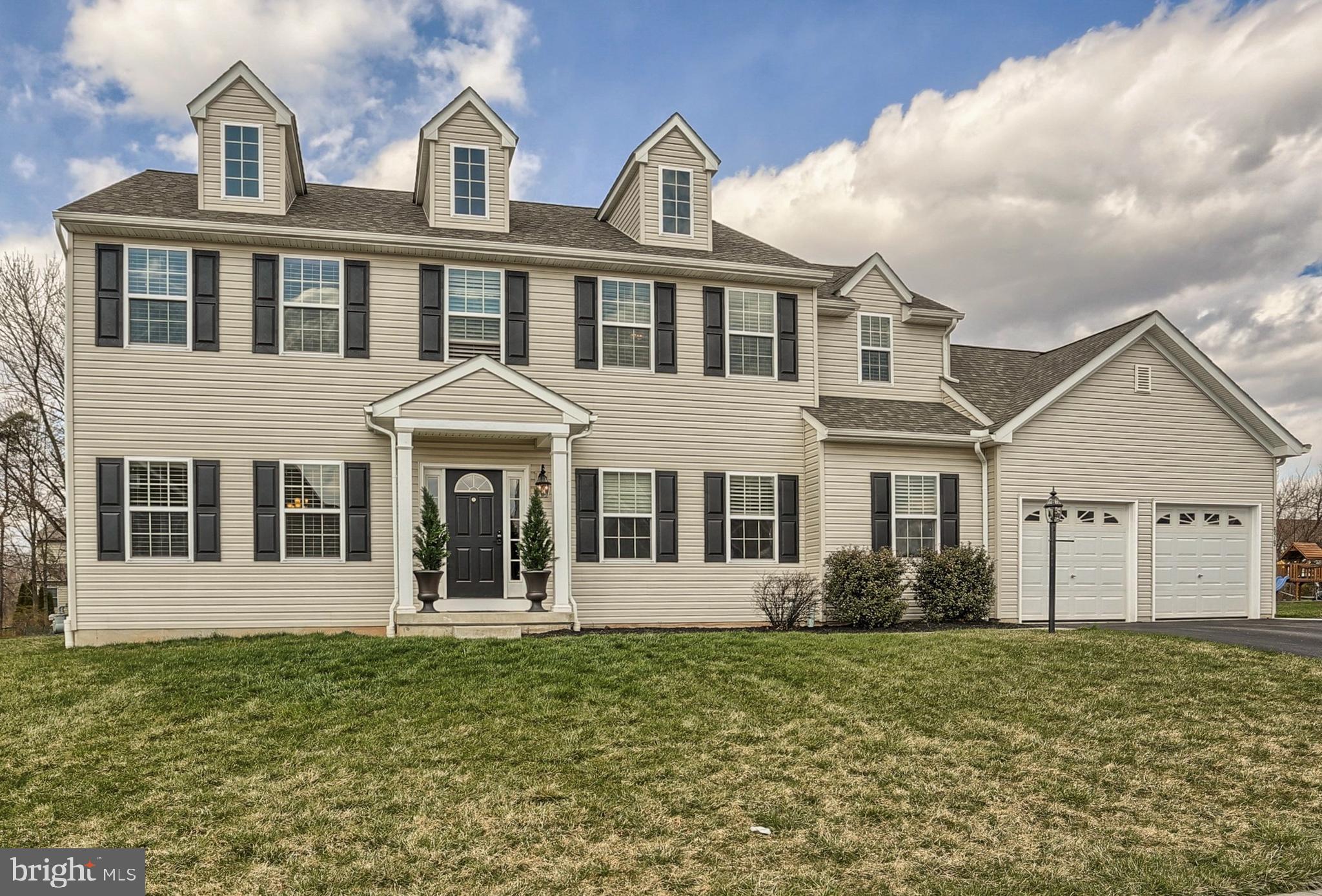 Don't miss the opportunity to own this great home in Central School District with a 1st floor in-law suite, and a partial view of Cousler Park! The beloved park's walking/biking trails, fields, playgrounds, events stage, pond/fountain, and picnic/BBQ areas are just steps away. One of two master suites is located on the first floor, with a full bath and walk-in-closet - perfect as a bright *in-law* apartment. Upstairs you will enjoy 4 Bedrooms, expansive walk-in closets, 2 bedrooms with fun "reading nooks" and a master bedroom suite with a luxurious bath. Additional features include a gourmet kitchen with a gas range and true exhaust hood, a gas fireplace, dual-zoned HVAC systems for savings and year-round comfort and a full bath rough-in in the basement for future expansion. This home is a must see!