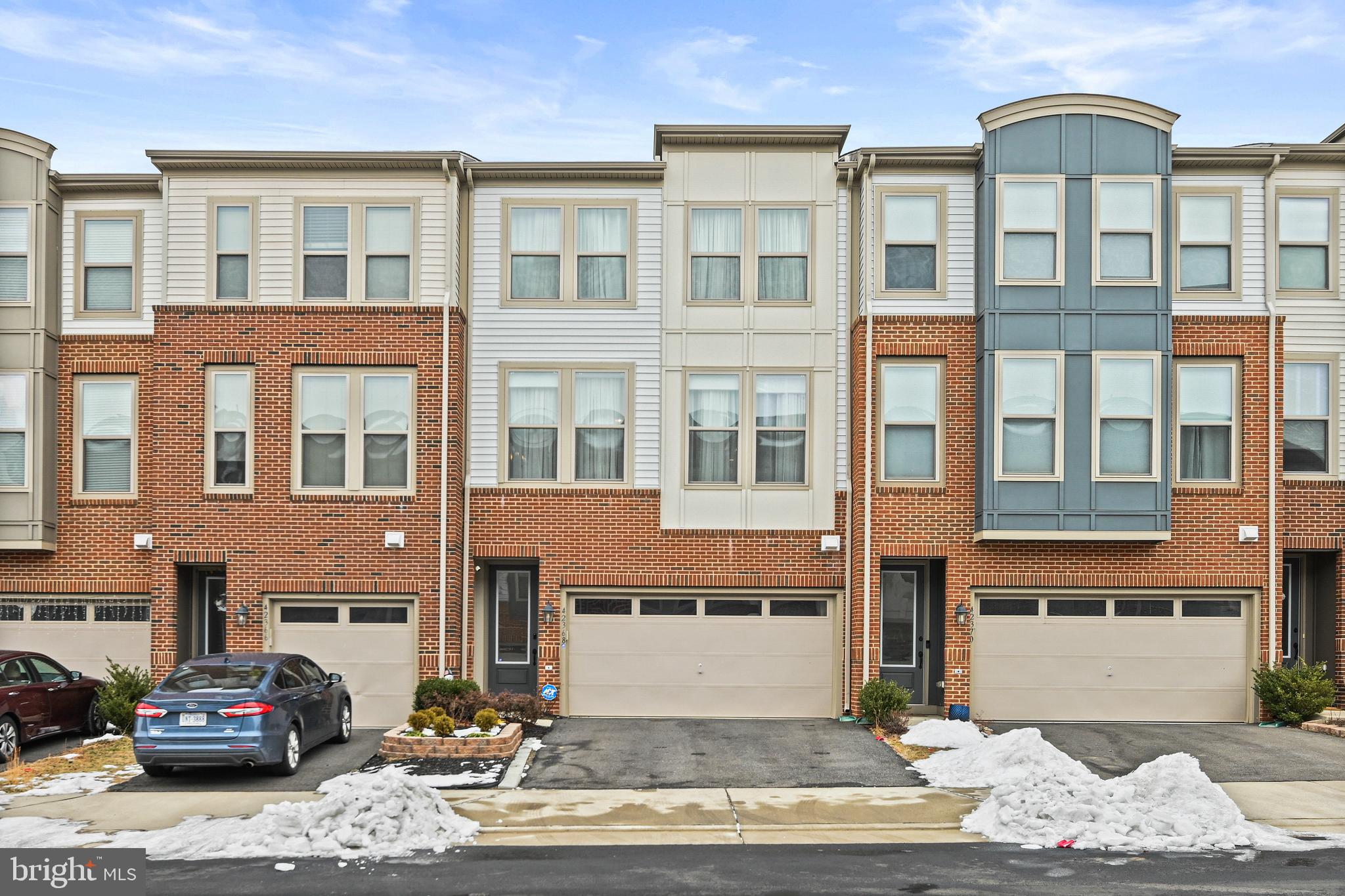 Your Dream Home Awaits: A Stunning, Light-Filled 3-Level Townhome. Welcome to 42368 Alder Forest Terrace! A rare chance to own a sophisticated 2018 Van Metre Home, nestled in the charming Glascock Field at Stone Ridge. Lovingly cared for by its original owners, this home perfectly balances tranquility, elegance, and functionality.

This spacious beautiful living design, nearly 2,600 sq ft offers 3 bedrooms, 3 full baths, 1 half bath, and a 2-car garage. Open views at the front and back, ensuring an abundance of natural light throughout.

The main level is an entertainer’s dream, with high ceilings, hardwood floors throughout including staircases, and an open floor plan. A gourmet kitchen with stainless steel appliances, a built-in microwave, a wall oven, an extended kitchen island, complete with elegant pendant lighting, offers ample space for meal prep, dining, and entertaining. The open floor plan seamlessly connects the sun-drenched living room—with its impressive wall of windows dressed in custom automated shades—to the formal dining area, creating a bright, inviting space. Step out from the kitchen onto a custom composite deck, perfect for al fresco dining. A cozy breakfast nook or home office space, along with a convenient half bath, completes the main level.

Upstairs, retreat to the serene primary suite, which features a tray ceiling, abundant natural light, a spacious walk-in closet, and ensuite bathroom with dual vanities, an upgraded frameless shower. Two generously sized secondary bedrooms, a full bathroom, and a convenient laundry closet round out the upper level.

The property features a professionally landscaped garden that sets a welcoming tone. Upon entering through the front door, secured with a Yale smart lock, you’ll find the lower walk-out level—a versatile recreation space perfect for relaxing, hosting movie nights, or entertaining guests. Complete with recessed lighting, a full bathroom, and a storage closet, this area also includes easy access to the garage. Step outside to the fenced rear stone patio, perfect for outdoor gatherings and BBQ.

Stone Ridge community offers exceptional amenities, including trails with pet-waste stations, three swimming pools, eight tot lots, three tennis courts, and a basketball court. The Nettle Mill clubhouse features a fitness center, a rentable event space, an outdoor patio, and an amphitheater perfect for hosting social events. The location is unbeatable—just 10 miles from Dulles International Airport, and major commuting routes.