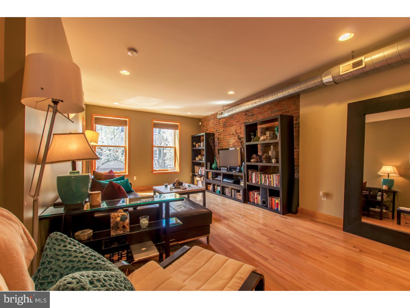 Welcome home to this sun-drenched, pet-friendly designer condo located in Bella Vista and the Meredith School Catchment!  Painted in neutral colors and with hardwood floors throughout, this condo has exceptional closet space including a storage area in the basement.  The Living Room has large Pella windows providing for Southern exposure and has exposed ductwork and brick.  A large, open floorplan from the living room into the kitchen makes it a great space for hosting guests.  Kitchen features GE Profile stainless steel appliances including a refrigerator with water dispenser & ice maker, gas stove, dishwasher, granite countertops, Brookhaven cabinetry, undermount sink and a kitchen island offering an entertaining experience.  Additionally, there is ample space for a formal dining area.  The kitchen leads to a balcony which overlooks a neighboring private courtyard providing for a quiet atmosphere and a European feel.  A spacious BR, large enough for a king size bed and additional furniture, has East-facing Pella windows, dual closets and a ceiling fan.  The 3-piece full bath has been recently upgraded to include a deep soaker tub, pencil tile in shower with glass tile inlay, frameless half glass shower door and 6-drawer vanity with Carrera marble top.  This condo unit has been meticulously maintained and professionally cleaned on a regular basis.  Walk right outside your door to the many shops, eateries and nightlife locations offered by living in Bella Vista and Queen Village.  Condo has a Whirlpool washer/dryer in the unit.  Easy commute into the city with the 47 bus that stops on the corner of 7th St. Low condo fees in this six-unit building!