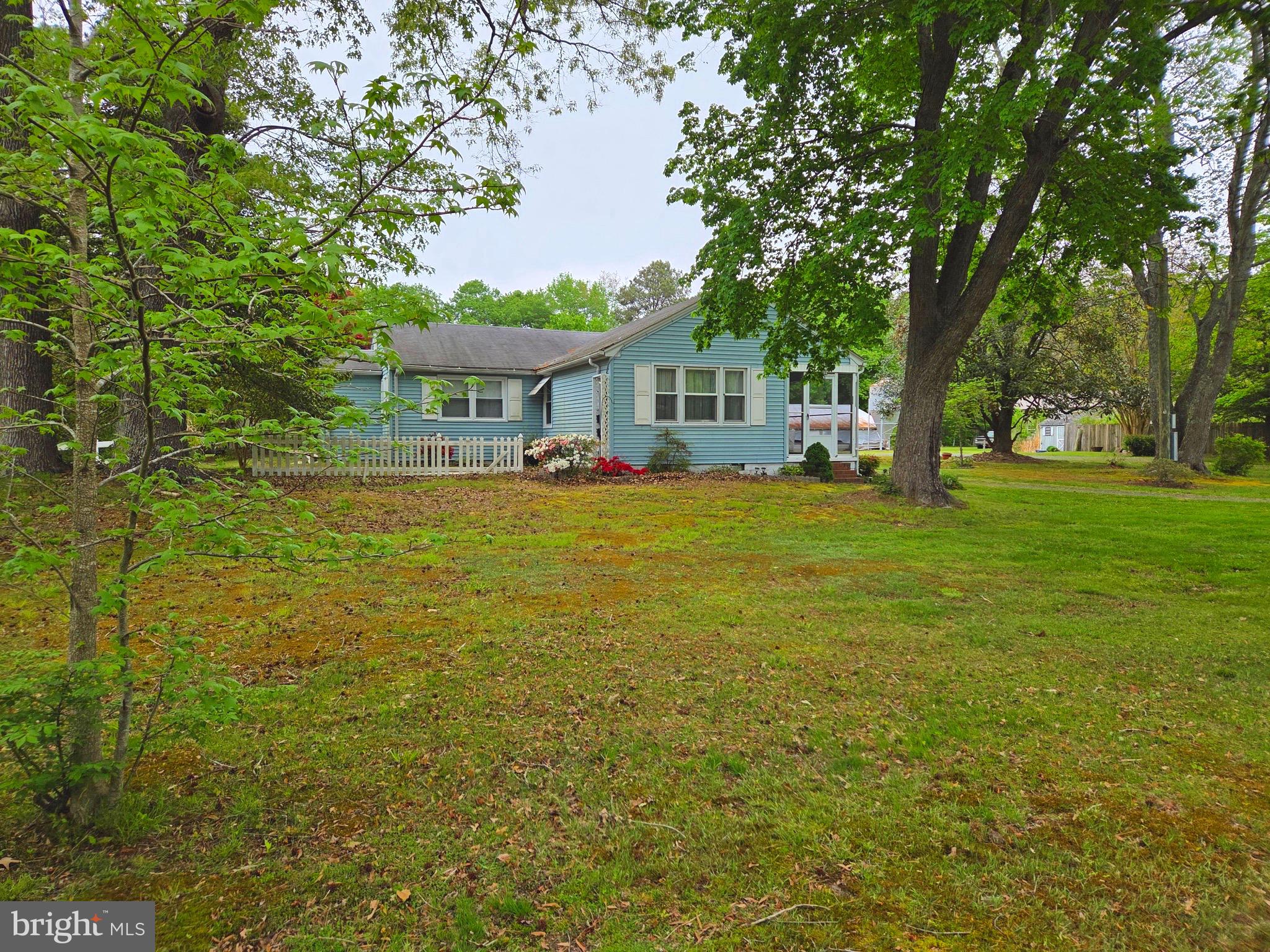 This classic cottage style home is waiting for someone to make it their own! Located on the outskirts of the quaint town of Parsonsburg, just 25-30 minutes from the Atlantic Ocean and the beaches in Ocean City, Fenwick, and Assateague Island, the home is NOT in an HOA! There are over 1 1/2 acres with 2 large storage(32 x 124) buildings as well as a smaller sorage shed. This home has 3 bedrooms and 2 bathrooms, family room, living room, dining room and utility room as well as a screened porch on the front of the home. The circular driveway and spacious yard provide a great back drop for entertaining your guests while also allowing for ample parking. And you are only minutes from Perdue Stadium, Centre at Salisbury, and Wor-Wic and Salisbury University  colleges. NO AI images! Real Photos.......