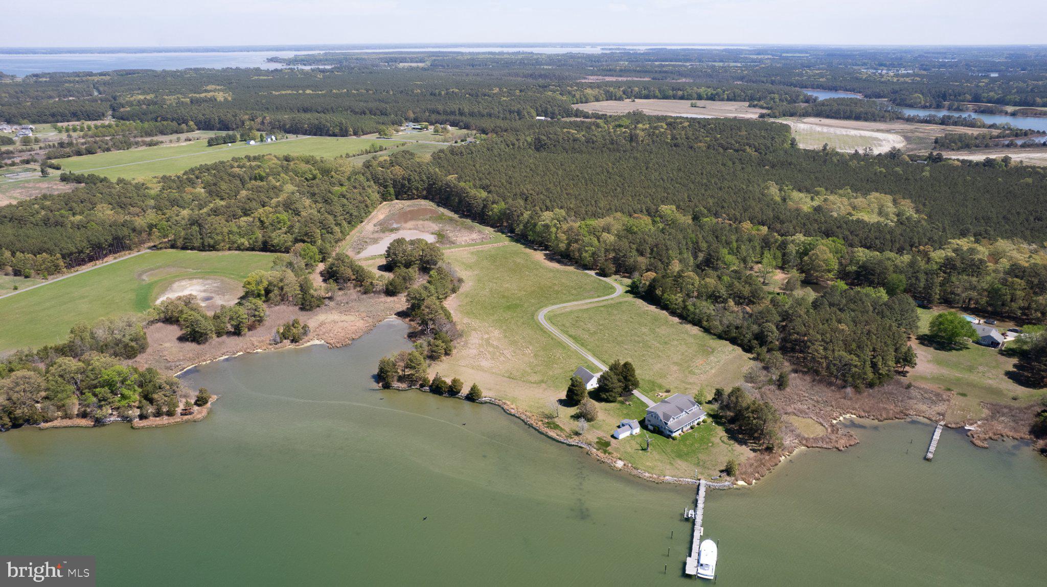 Welcome to a rare waterfront retreat on Hudson Creek offering 30± acres of privacy, recreation, and breathtaking natural beauty with easy access to the Chesapeake Bay. With over 1,000± linear feet of shoreline and stunning water views throughout, this exceptional property is perfectly suited for boating, fishing, hunting, or simply relaxing and taking in the peaceful surroundings.

The property features an extended private pier complete with boat lift, providing direct and convenient water access for all your waterfront activities.  A significant bonus is the DU impoundment ideal for waterfowl habitat.   

The home offers 4 spacious bedrooms and 3 full baths and 1 half bath, designed to accommodate both comfortable everyday living and entertaining. A massive great room and dining area serve as the centerpiece of the home, highlighted by an open balcony that surrounds the space and creates a dramatic, airy feel. Dual stairways provide access to the upper level, adding both functionality and architectural appeal and water views.

The eat-in kitchen includes a center island and stainless steel appliances, ideal for gatherings and casual dining. A bright and inviting sun porch offers the perfect place to enjoy morning coffee or unwind while overlooking the water.

Additional features include a laundry/utility area, welcoming front porch, and a rear porch that further captures the serene water views.

Outside, you’ll find a storage shed and a detached two-car garage, offering ample space for equipment, vehicles, and recreational gear.

Whether you’re seeking a private waterfront residence, a weekend escape, or a recreational haven (boating, kayaking, fishing and hunting), this unique property delivers unmatched space, versatility, and waterfront living.