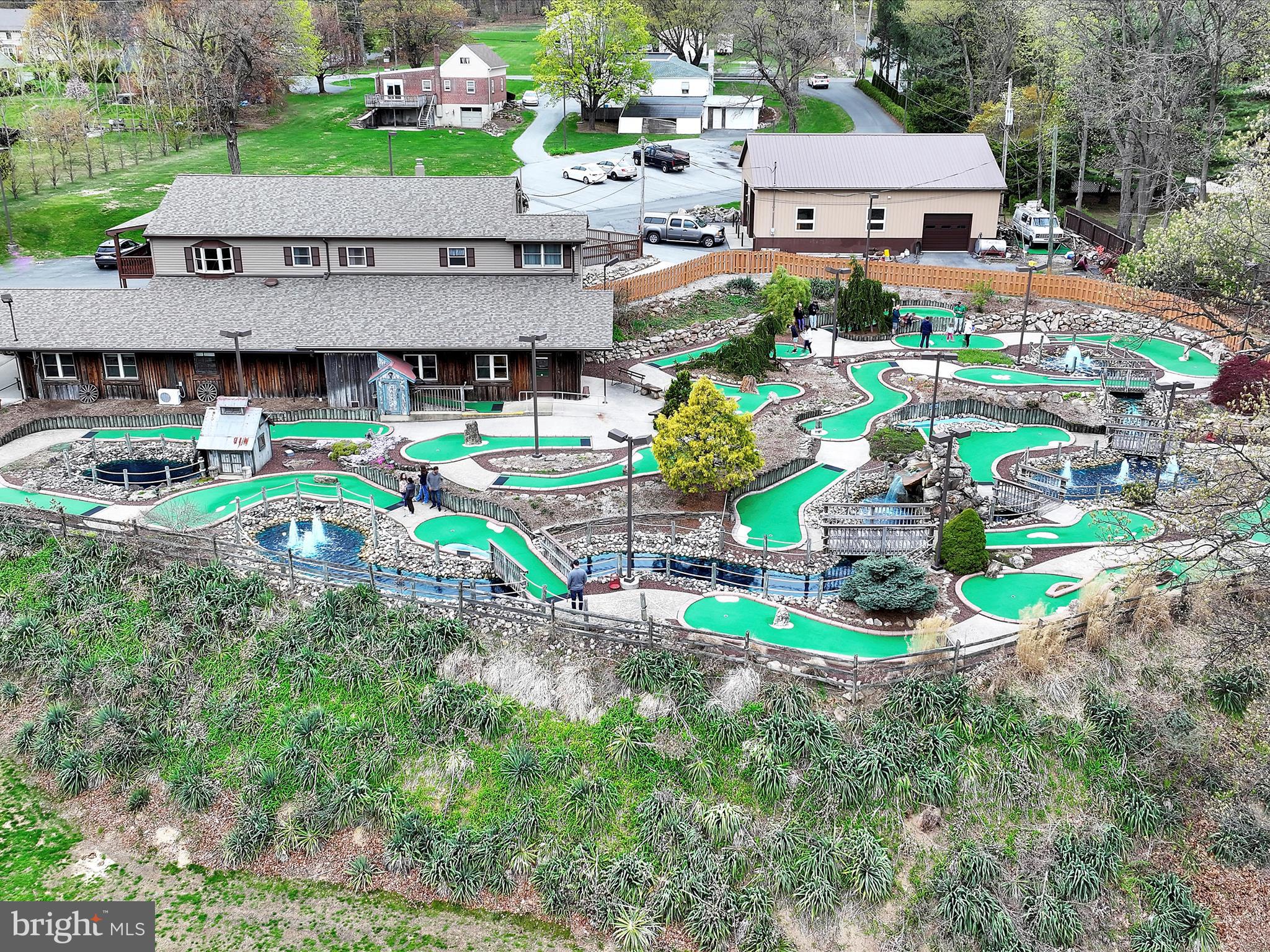 A rare opportunity awaits you. Gasser's Golf is now available to purchase. Owners are retiring after multiple decades and multiple generations of successful ownership. The sale will include the business and multiple pieces of real estate. The primary piece is the driving range, miniature golf, snack bar/pro shop, updated range and added mini golf in 2002 with owners residence above and 15 plus acres. Also included is address 3243 Pricetown Road - a 2400 square foot home (needs full rehab) sits on an acre lot with a wonderful stick built 2000 square foot detached garage/workshop with full power and heat. The final piece is a .13 acre lot that enhances the parking for this thriving golf entertainment operation. This operation is turnkey and offers a 19 tee box driving range, a 19 hole miniature golf course with multiple water features, a snack bar and pro shop featuring both hand dipped and soft serve ice cream and a putting green to sharpen your skills. The retails operation is supported by 45 parking spaces and full exterior lighting for extended operation. The owners residence above offers 3 bedrooms, 2 full bathrooms, a sure to please updated maple kitchen with granite tops, a living room, laundry room and dining area. Lower level offers a family room, office and utility maintenance area. The total finished area of this building is nearly 6000 square feet plus a nice covered owners deck on the west end with beautiful views of the facility. All this plus the 3243 detached residence could be rehabbed and turned into an income producing unit and 2 entrances/egresses to Pricetown Road on a C-1 and R-3 zoning lots. Properties are not connected to Alsace Township's public sewer system but lines have been run to close proximity of drain fields areas for future hookup if needed. Pavilion over tee boxes and outdoor seating area offers fluorescent lighting and ceiling fans, a 35 KW diesel generator to support a good portion of the operation in times of power outages and so much more make this the one to see! Schedule your tour today and don't let this opportunity pass you by.