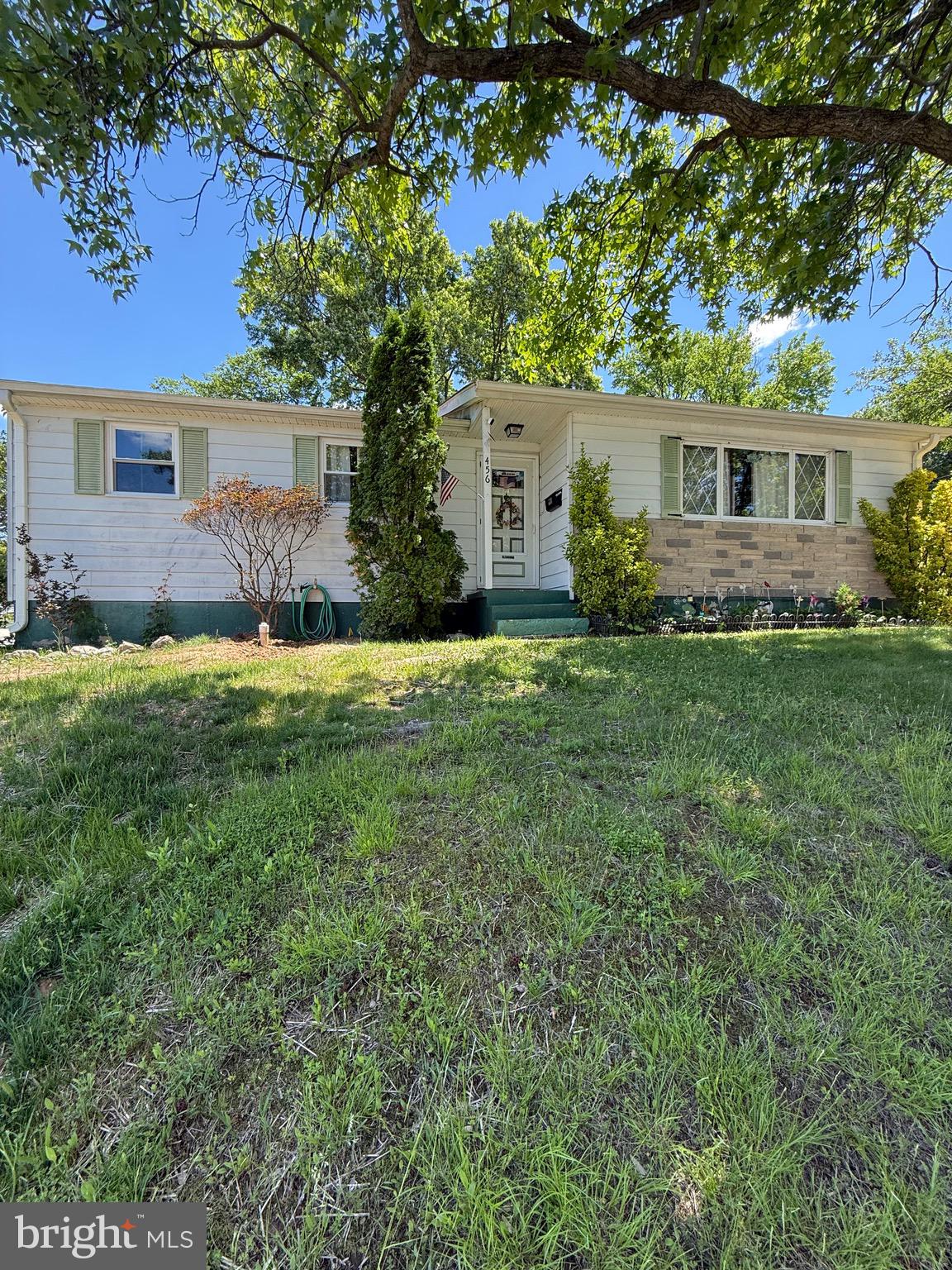 Well-maintained 3 Bedroom, 2 Full / 1 Half Bath single-family raised rancher (with basement) atop a nearly 1/4 acre CORNER LOT that is ideally located just 0.1 miles from Maryland City Elementary School. This cozy home with over-sized entry level living room -- including a wood-burning fireplace -- offers a spacious layout with ample storage space, a fenced-in backyard perfect for outdoor enjoyment, and a private driveway large enough for at least 2 cars, and adjacent on-street parking.  Major updates have already been completed, including ALL NEW double-hung windows on the main level (excluding the front living room bay window) and new sliding glass door (off the dining room to the rear yard), new tile in hall tub shower bathroom, newer OVEN/RANGE (Fall 2025), recent HVAC system (installed in July 2023), and a recent architectural roof (installed in August 2020). The cast iron sewer line from the interior basement to the front curb has also been replaced with durable PVC piping. The lower level living area boasts new luxury vinyl plank throughout the generously-sized recreation room, separate bonus room with two (2) interior closets, and bath/laundry room; the remainder of the full size lower level offers gobs of storage space and a workshop area with shelving, or flexibility if you like the idea of additional space for future rooms. Conveniently located near shopping, dining, and everyday amenities, with a brief drive to Rt. 295 (Baltimore-Washington Parkway) for easy commuting access.  Compared to the competition, you get more and longer-lasting bang for your buck.