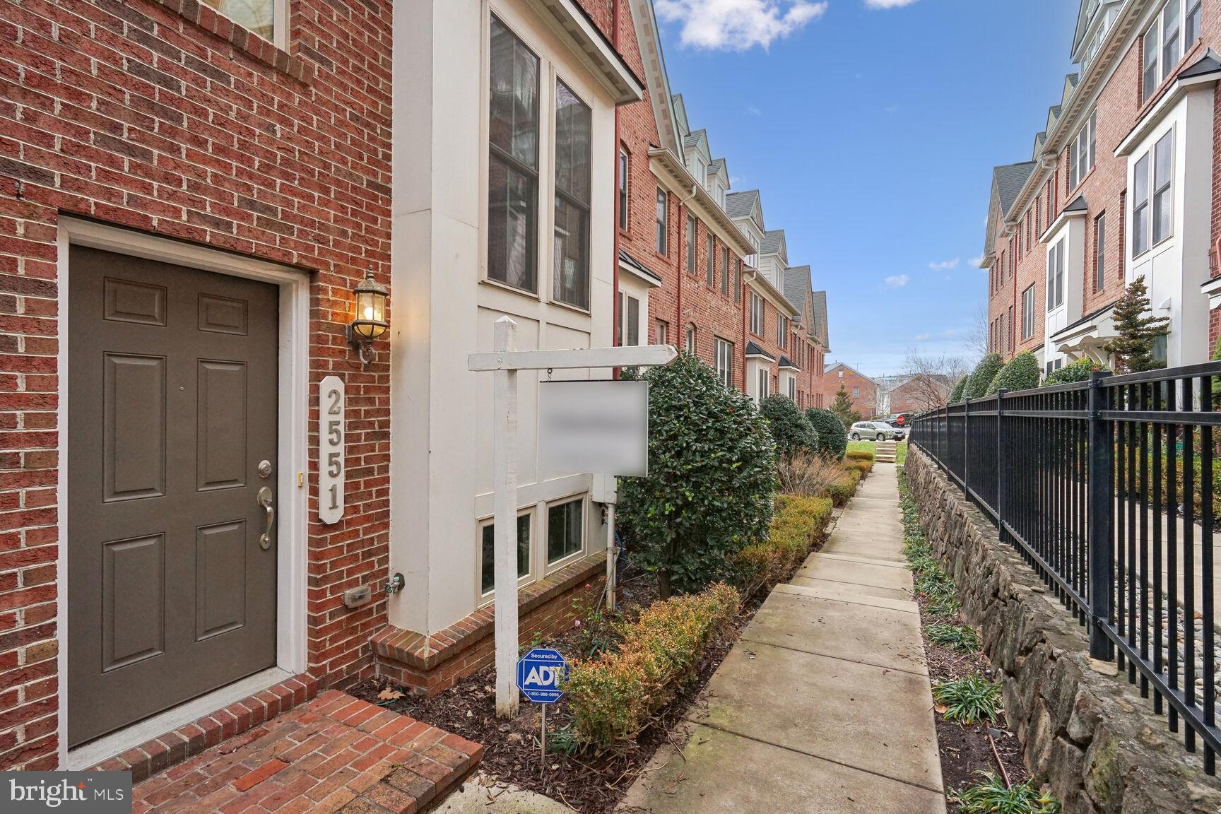 **OFFER DEADLINE-12pm-Tuesday, 1/16** Welcome to Shirlington Crest, where convenience meets elegance in this meticulously maintained 2-bedroom townhouse. Boasting a custom den, 2.5 bathrooms, and a 3-level design with a brick front, this residence is the epitome of modern living. The attached 2-car garage and rooftop terrace add a touch of extravagance to the property.

As you enter through the foyer, the choice is yours: descend to the English basement leading to the garage or ascend to the main level. Hardwood floors and an abundance of sunlight grace the open-concept living area on the main level. The living room is a beacon of light, adorned with oversized windows and sliding doors opening to a Juliet balcony. Transition past the powder room to the dining area, where recessed lighting and a new designer fixture above the table set the perfect ambiance.

In the kitchen, discover granite countertops, a stone backsplash, matching hardwood cabinets, and chef level stainless steel appliances. A built-in microwave hovers above a gourmet 5-burner gas cooktop, complemented by double ovens. Ascend to the second level, where 2 bedrooms, 2 full bathrooms, and laundry service await. The primary suite is a haven with recessed lights, a ceiling fan, walk-in closet, and an en suite bath featuring double sinks and an oversized shower. The secondary bedroom, complete with double closets, is just down the hall past the second full bathroom.

The third level unveils a rooftop terrace, offering an outdoor living oasis with breathtaking views. Additionally, a custom-designed office/den space awaits – the perfect retreat for remote work or a mindfulness escape. This space features a massive closet for convenient storage. The freshly painted garage accommodates two large cars/SUVs with ease, providing additional storage.

Situated at mile marker zero of the W&OD Trail, accessibility is unparalleled. Jennie Dean Park and the Shirlington Dog Park are conveniently located across the street. A mere 0.3 miles away, Harris Teeter awaits, while diverse dining options lie within a quarter mile. Enjoy the ease of shopping, entertainment, and daily errands at nearby Shirlington Village. With effortless access to major commuter routes, National Landing, and Amazon HQ2 just minutes away, this property seamlessly combines luxury and convenience. Welcome to a lifestyle curated for the discerning buyer.
