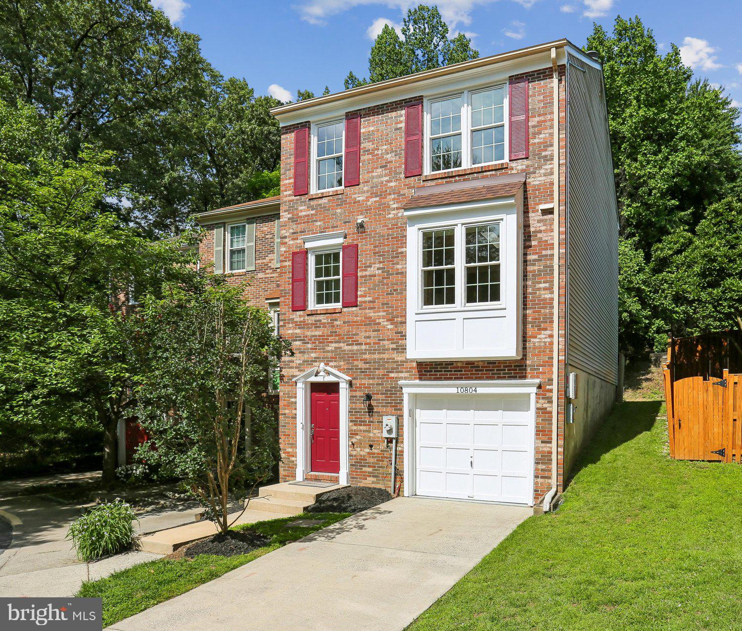 Stunning, 3BR/2.5BA, brick-front, one-car garage end-unit townhome located in the highly desirable neighborhood of Stephen Knolls. This home spans approximately 2,000 sq. ft on three level including:  hardwood flooring throughout main level; new carpeting on upper level and stairs; LVP and ceramic tile flooring on lower level; updated granite, stainless kitchen and ceramic tile bathrooms; freshly painted interior and exterior, newer hot water heater, updated light fixtures, electric car charger in garage and solar (owned). Freshly landscaped exterior with deck and pergola perfect for entertaining. Inviting foyer entrance with tile flooring, multiple closets for storage and access to garage; recreation room with office nook featuring skylights, LVP flooring and wood-burning fireplace with slate hearth; living with hardwood flooring, triple box/bay window and access to back deck; separate dining room with hardwood flooring, chandelier and pass-through to kitchen; updated gourmet kitchen with maple cabinetry, granite countertops, Maytag and Kenmore stainless steel appliances, pantry and separate laundry area with shelving; adjacent powder room with vanity and hardwood flooring; primary bedroom suite with wall-to-wall closets with built-ins and ceiling fan with light; updated primary bathroom with ceramic tile flooring, maple vanity with dual sinks and granite countertops, walk-in shower with glass enclosure and designer tile surround; two additional bedrooms on the upper level with new carpet and updated full hall bath featuring ceramic tile flooring, vanity with granite countertop and tub/ shower with designer tile surround. The Stephen Knolls community has great access to a vibrant array of international dining and shopping options just minutes away. With 4 Red Line Metro stops and Marc Train Station within five miles, and quick access to I-495, Rt. 29, and Rt. 97, commuting to Baltimore, D.C., or Northern Virginia.