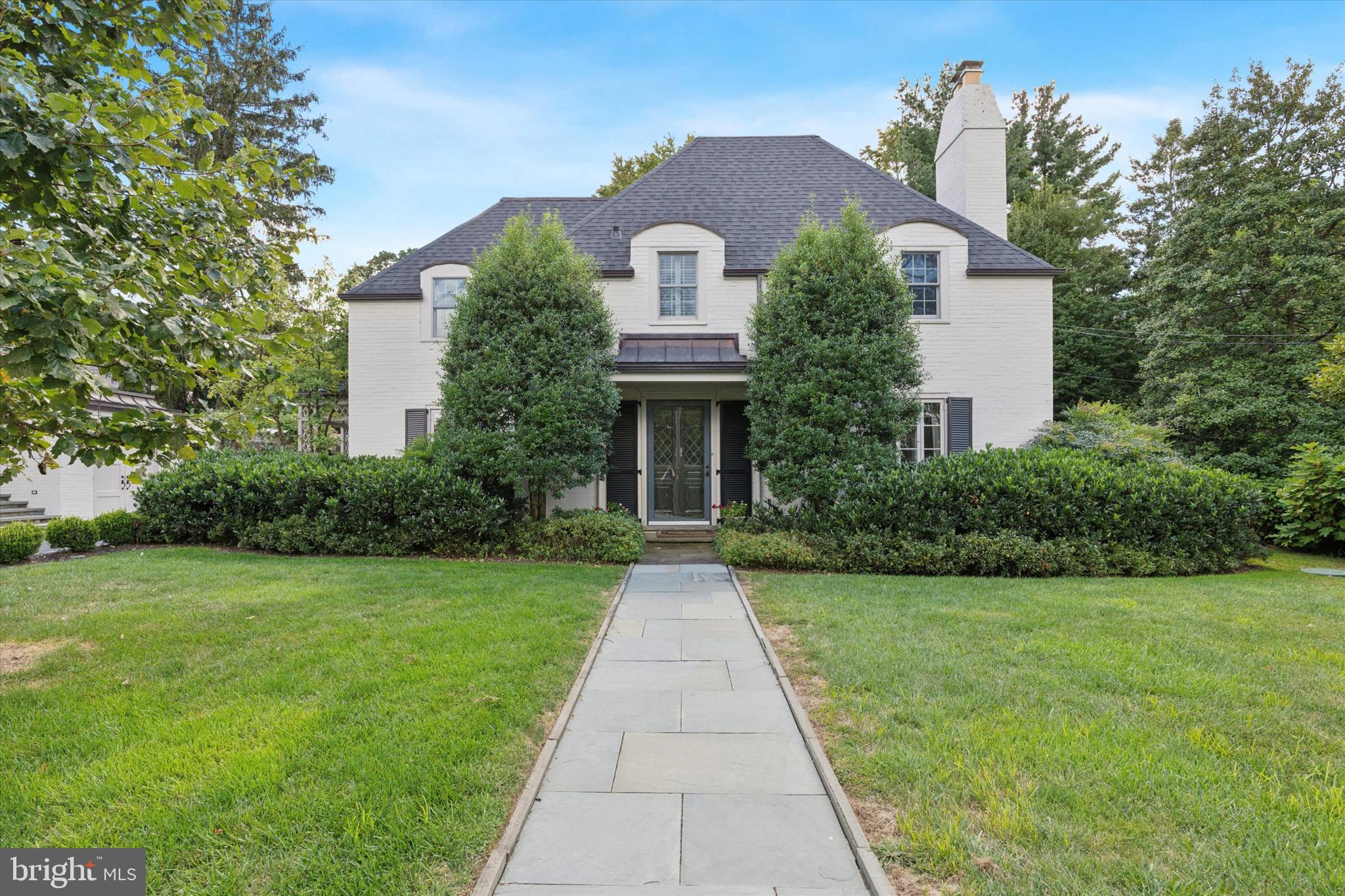 Prepare to fall in love with this 1920's French Colonial located on a corner lot in the heart of Wyndmoor.  This property has been meticulously improved and maintained by the current owners to allow for gracious entertaining and modern living. Enter the home from the copper roofed front portico to the center hall. To the right is the living room with wood burning fireplace and French doors to the covered flagstone patio overlooking the private backyard and garden stone wall. The living room opens to the dining room with a corner hutch and a door to the back patio. The dining room flows to the side door entrance hall with built-in bench and cabinetry and to the heart of the home: the kitchen and family room.  The bright cook’s kitchen with center island includes custom cabinetry from Village Handcrafters, double ovens, Wolf gas cooktop and Sub-Zero refrigerator.  It is open to the family room with a full wall of built-in cabinetry. The family room includes doors to both the backyard and to the courtyard with vine covered pergola.  A charming office and powder room complete the first floor.  The ribboned staircase banister leads to the second floor with a large sitting room. The primary bedroom includes an updated en suite bath with shower and custom cabinetry. Two additional bedrooms, two additional updated bathrooms and a convenient laundry room complete the second floor. There is a walk up attic and an unfinished basement for all your storage needs.  The property boasts details including refinished random width pegged floors, moldings and double paned casement windows. The exterior includes a newer roof, copper gutters and downspouts, flagstone front walkway and side steps to Spring Lane, Belgian block apron and lined driveway, stone walls, charming courtyard with vine covered pergola and large garden shed. Professionally landscaped, the magnificent gardens will impress with perennials and specimen trees blooming throughout the seasons. You will love this vibrant community, close to the shops and restaurants in Wyndmoor and Chestnut Hill, with easy access to two regional train lines.

The listing agent is related to the owners.