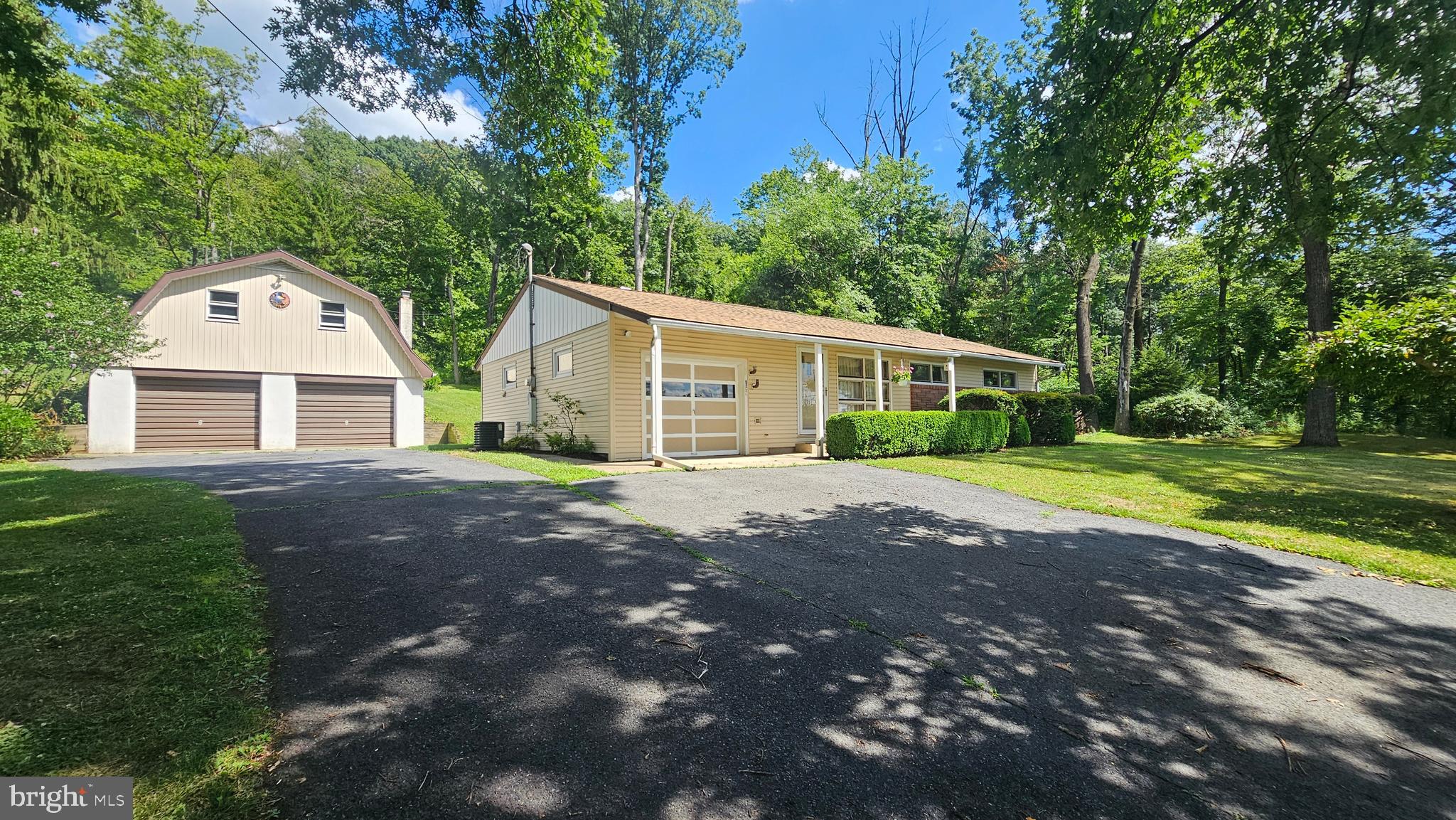 ALL OFFERS KINDLY REQUESTED BY NOON, Wednesday, July 15th. Offered for sale for the very first time by its original owner, this lovingly maintained 4-bedroom ranch offers the perfect blend of comfort, functionality, and pride of ownership. Nestled on a peaceful 1.5 acres on two parcels in highly desirable Lower Saucon Township, this property provides a tranquil setting while remaining conveniently close to everyday amenities. Step inside to discover a bright, welcoming interior filled with natural light from oversized windows. The open-concept living, dining, and kitchen areas create an inviting flow, ideal for both everyday living and entertaining. The spacious kitchen features abundant cabinetry, generous countertop space, and modern appliances, making meal preparation a breeze. Each of the 4 bedrooms offers ample closet space, while a centrally located full bathroom serves the home with ease. Added central air conditioning ensures year-round comfort, and the utility room located just off the kitchen enhances the convenience of true one-floor living. Car enthusiasts, hobbyists, and those needing extra storage will appreciate the detached two-car garage, complete with an expanded second level and walk-out double-door access to the backyard—offering endless possibilities for a workshop, studio, or additional storage. Additional highlights include a newer roof and the highly regarded Saucon Valley School District (K–12). With its exceptional care, desirable location, and spacious grounds, this is a rare opportunity to own a home that has been cherished for generations. Schedule your private showing today and experience everything this special property has to offer.