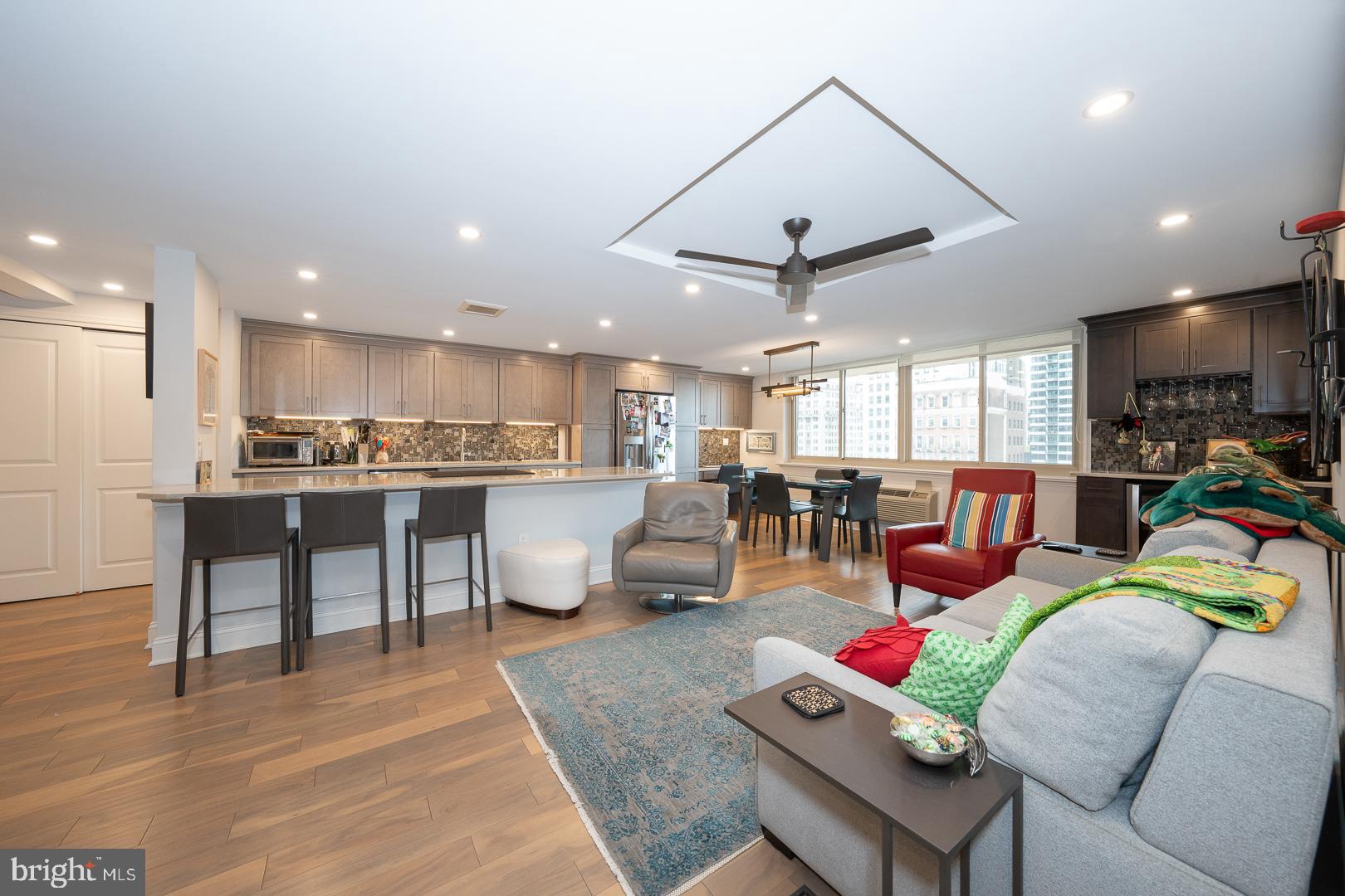 Beautifully updated and rarely available southwest corner residence on the 10th floor at the sought-after William Penn House in Rittenhouse Square. This spacious 2-bedroom, 2-bath home offers approximately 1,176 square feet of light-filled living space with an open, flowing layout ideal for both everyday living and entertaining. Rich hardwood floors extend throughout the expansive living and dining areas, highlighted by a tray ceiling with ceiling fan and a stylish built-in bar complete with wine refrigerator. The beautifully updated kitchen features a breakfast bar, stainless steel appliances, a built-in desk area, and a convenient laundry closet, along with abundant cabinetry and generous workspace. The primary suite offers a peaceful retreat with a renovated ensuite bathroom featuring a walk-in shower. A well-sized second bedroom and an updated full hall bathroom with a walk-in shower and built-in seat provide comfort and flexibility for guests, home office use, or additional living space. Enjoy exceptional natural light and sweeping city views from this prime southwest exposure, all within a full-service building just steps from the best of Center City living, including world-class dining, shopping, and parks.
This building features 24-hour Security and Doorman, On-Site Management and Maintenance, Rooftop Pool with amazing views of the city. On premise VALET Parking available for 100 per month for one car. THE MONTHLY FEE INCLUDES ALMOST EVERYTHING: All Utilities including electric, heat, air conditioning, water & basic cable, All Real Estate Taxes & Maintenance Package. This unit has an abundance of closet space, newer windows  in unit! Washer & dryer in unit! This spectacular building has NEVER HAD AN ASSESSMENT! Nominal real estate transfer tax & no title insurance required. Experience the ability to walk out your door to first class, 4-star restaurants, fabulous shopping & all the conveniences of this sought after neighborhood. Walk score is a 98! One time admin fee paid at closing.