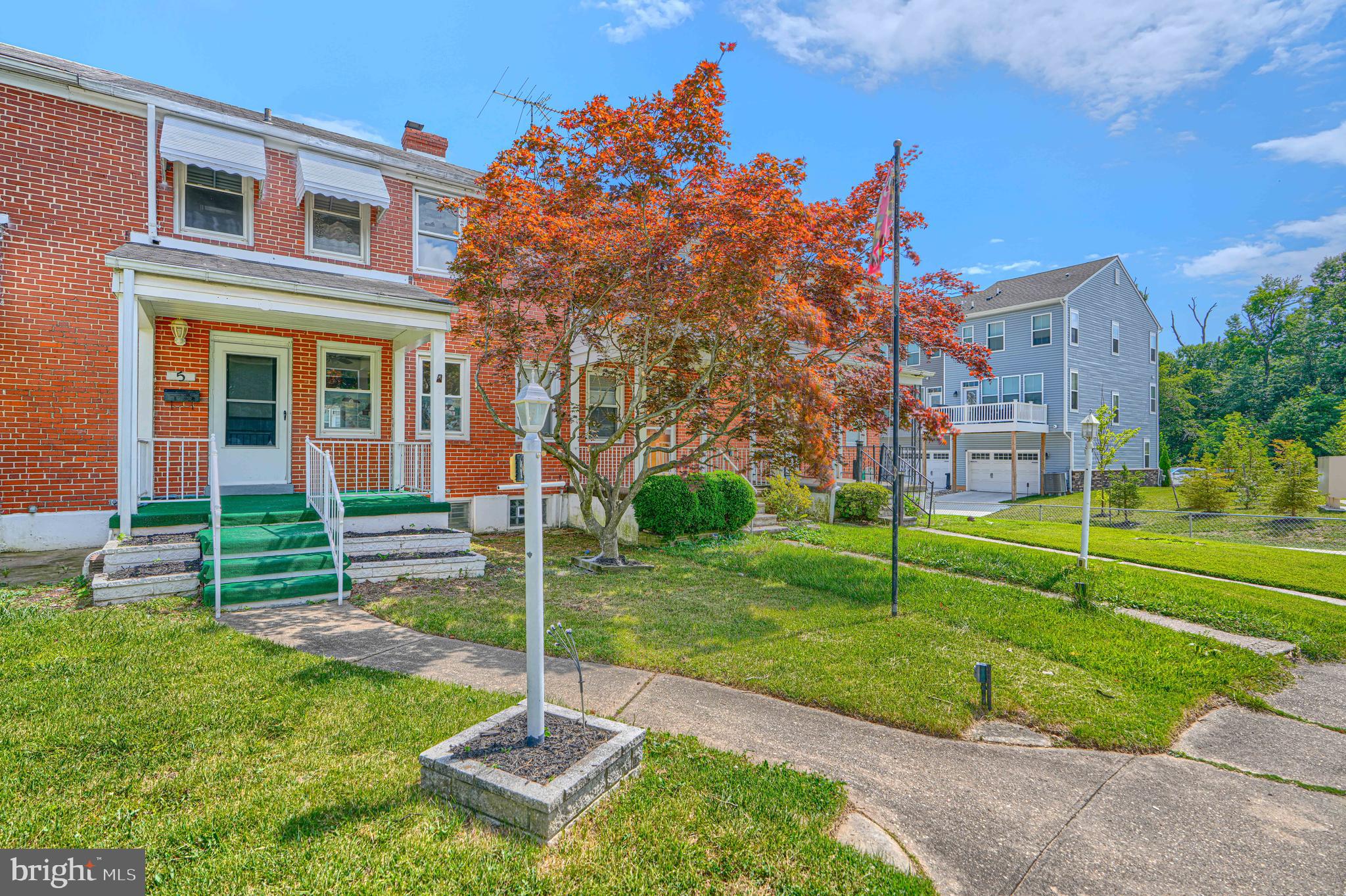 Welcome to 5 Cardinal Road, a beautifully updated 3-bedroom, 2.5-bath brick townhome tucked away on a quiet cul-de-sac in Essex. Combining modern updates with timeless charm, this move-in-ready home offers three finished levels of comfortable living space in a convenient location close to shopping, dining, parks, major commuter routes, I-695, I-95, and the Baltimore waterfront.

The main level features beautiful finished hardwood floors throughout, a spacious living room, a separate formal dining room, and an updated kitchen complete with granite countertops, stainless steel appliances, and ample cabinet space. Step outside onto the rear wood deck overlooking the fully fenced backyard, providing the perfect space for relaxing, entertaining, or enjoying outdoor activities.

Upstairs, you'll find three generously sized bedrooms and a full bathroom with a tub/shower combination. The finished lower level offers additional living space with luxury vinyl plank flooring, a full bathroom with a stand-up shower, and endless possibilities for a family room, recreation room, home office, gym, or guest space.

Additional highlights include a welcoming covered front porch, brick exterior, and a thoughtfully updated interior that still maintains plenty of character. Don't miss the opportunity to make this beautiful Essex home your own—schedule your private tour today!