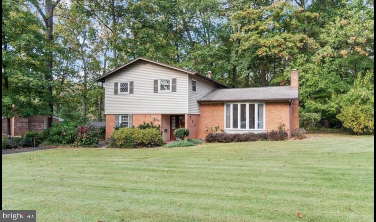Nestled in the serene enclave of Sleepy Hollow Woods, this exquisite split-level home, beautifully renovated in 2022, offers a harmonious blend of modern luxury and timeless charm. Spanning 1,272 square feet plus downstairs space, the residence features four spacious bedrooms and two and a half elegantly appointed bathrooms, ensuring comfort and convenience for all. Step inside to discover a warm and inviting atmosphere, highlighted by rich hardwood floors and plush carpeting. The heart of the home is the gourmet kitchen, equipped with high-end appliances including a gas oven/range, built-in microwave, refrigerator, and dishwasher, perfect for culinary enthusiasts. Retreat to the primary suite, complete with a luxurious walk-in closet and a spa-like bathroom featuring a tub shower. The additional bedrooms are generously sized, offering ample space for relaxation or productivity. Enjoy tranquil views of the surrounding trees and woods from your private enclosed screen porched, perfect for morning coffee or evening relaxation. The outdoor space is complemented by a spacious deck, ideal for hosting summer barbecues or enjoying quiet evenings under the stars. With a large lot of 0.43 acres, this property also includes a charming storage barn/shed, providing extra space for your hobbies or storage needs. Experience the exclusive lifestyle this home offers, where comfort meets elegance in a picturesque setting, right inside the beltway!