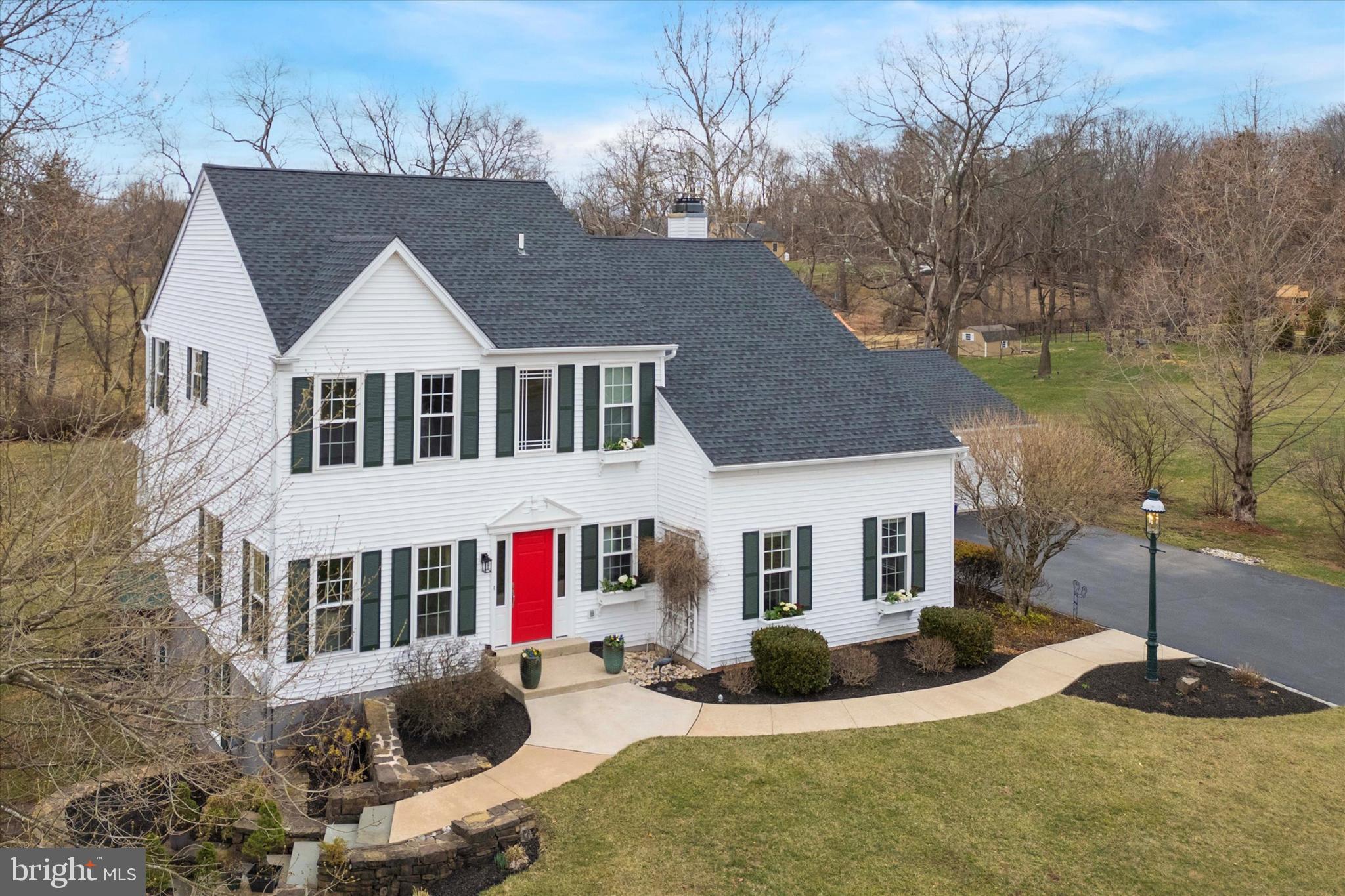 *******HIGHEST & BEST OFFERS DUE BY SUNDAY, APRIL 6th at 8pm******Nestled in an established Skippack Township neighborhood, this 4-bedroom, 2.5-bath colonial sits on a spacious lot just under an acre with wide streets, sidewalks, and no HOA fees. The first level features distressed Georgia pine hardwood floors and a two-story foyer with wainscoting, The bright and inviting living room leads to the dining room, currently used as an office, with custom louvered shutters.

A remodeled and expanded kitchen is the heart of the home, offering granite countertops, 42” maple cabinets with under-cabinet lighting, a cobbled stone backsplash, and stainless steel appliances. A walk-in pantry with a coffee bar and pocket doors, a kitchen island with a walnut countertop, built-in bookcase, and pendant lighting, and a large deep sink overlooking the back porch complete the space. A wood-burning fireplace with a custom wood surround and recessed lighting adds warmth and charm.

The oversized family room, created from a converted garage, is flooded with natural light and features built-in bookcases and an outside exit with a portico leading to the driveway.

Upstairs, the owner’s suite boasts a double-door entry, spruce hardwood flooring, and a cathedral ceiling. The en suite bathroom is a sanctuary, complete with a freestanding soaking tub, walk-in shower with stone tile walls and a niche, slate flooring, wainscoting, built-in linen storage, and a walk-in closet. The three additional bedrooms include engineered wood flooring, ceiling fans,  and custom closet organizers. They share an updated hall bath featuring slate flooring, an oversized walk-in shower with sliding "barn-door style" glass doors and ceramic tile, a double vanity with barn-style doors, and beadboard-style wainscoting.

The finished basement provides extra living space with a dedicated office with engineered wood flooring and a daylight window, plus a large recreation room with luxury vinyl plank flooring, recessed lighting, and an exterior exit. There is ample storage under the staircase and in the utility room, which also serves as a workshop.

Outdoor living is truly special, with a covered six-column porch spanning the width of the home. This space includes IPE Brazilian hardwood flooring, a ceiling fan, lighting, a stone retaining wall on one side, and pavers on the other. Enjoy breathtaking sunset views as the property backs up to a farm and borders a stream.

This home is beautifully finished as all interior windows are framed, and there is crown molding and  5” floor molding throughout.  Additional highlights include a 2.5-car detached garage with a lighted cupola and weather vane, upgraded door handles and hinges, a new water heater (2025), and replaced front and side windows. This is a rare opportunity to own a beautifully updated home in a sought-after neighborhood near Skippack Village, Palmer Park, Providence Town Center, shopping, and dining.  This home is a MUST see!