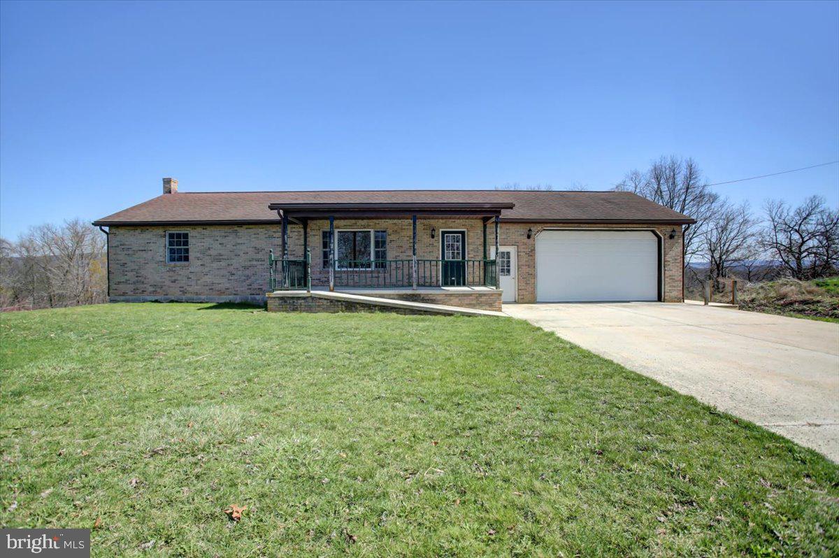 Welcome to this delightful 2-bedroom, 2-bathroom brick home, THERE IS ALSO AN ADDITIONAL ROOM WITH OPEN POTENTIAL FOR A HOME OFFICE OR HOBBY SPACE. This home is nestled on a spacious 0.5-acre lot in the picturesque Forbes Road School District within Fulton County, PA. With 1,748 square feet of above-grade, single-level living space, this property offers a perfect blend of comfort and convenience. 
This home is thoughtfully designed for ease of access. Enjoy the convenience of having the laundry on the main level. Modern amenities include central air conditioning and the flexibility of oil or wood heating. The concrete driveway leads to a 2-car garage, ensuring plenty of parking and storage. The 1,575 square feet basement includes a full bathroom and offers potential for expansion or customization.
Located in a serene country setting, this home is surrounded by farm life, offering a tranquil escape from the hustle and bustle of city life.  Don't miss the opportunity to make this charming property your new home!