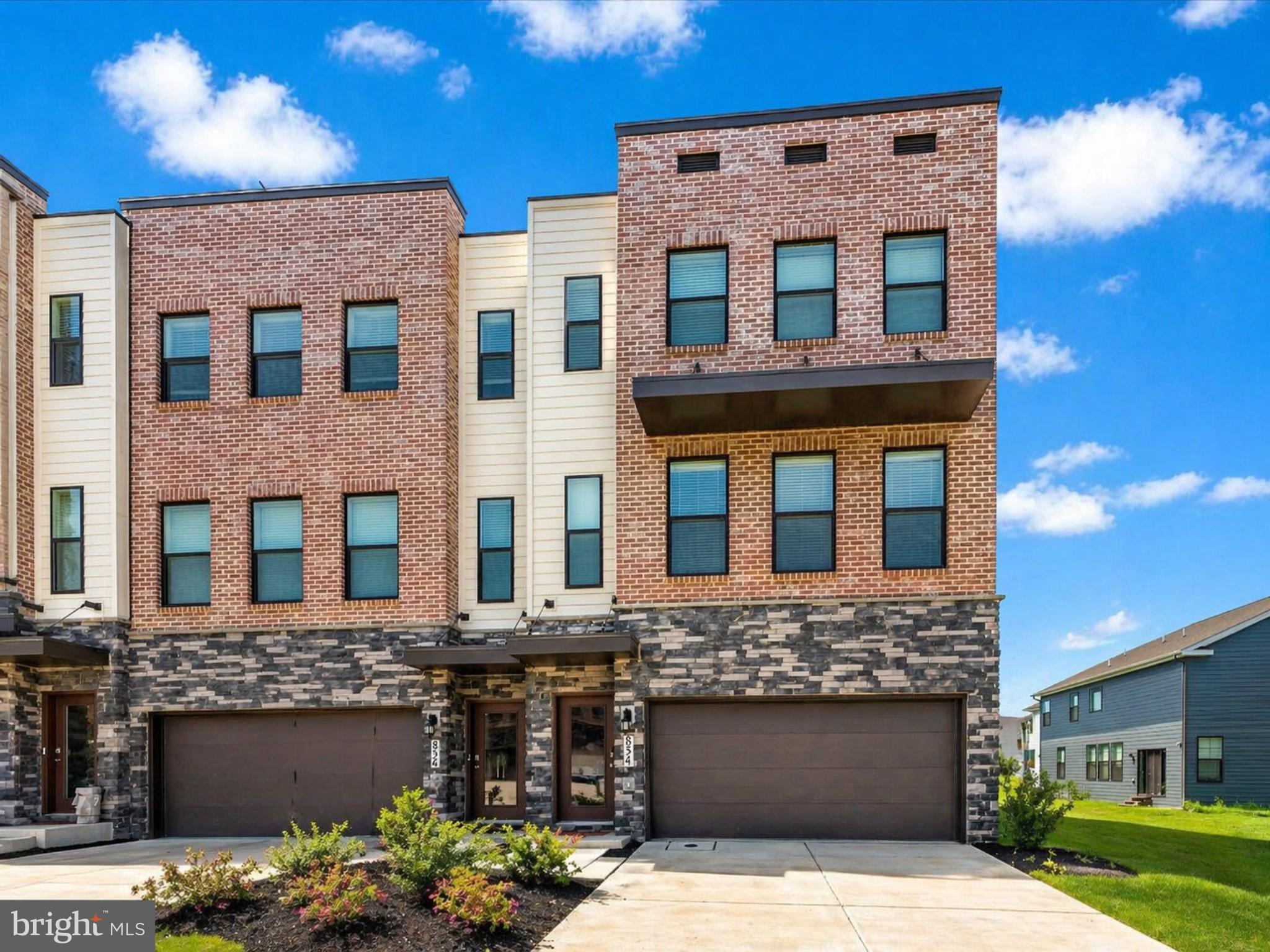Positioned at the edge of Renn Quarter,  Frederick’s premier urban enclave, this Auburn end-unit redefines modern luxury with a commanding presence, sun-drenched exposures, and a level of finish rarely seen in today’s market. Built in 2023 and thoughtfully curated with every available upgrade, this 4-bedroom, 3.5-bath residence spans 2,270 square feet of elevated living where soaring 9-foot ceilings and expansive windows flood each space with natural light, creating an atmosphere that feels both refined and effortlessly inviting. The main level unfolds with seamless flow, anchored by a designer gourmet kitchen that serves as the heart of the home—featuring sleek stainless steel appliances, an oversized island ideal for gathering and entertaining, and an abundance of premium cabinetry, all set against rich luxury plank flooring that adds warmth and continuity throughout. Ascend the hardwood staircase to a private upper-level retreat where the primary suite exudes tranquility, complete with a spacious walk-in closet and a spa-inspired bath designed with both elegance and function in mind. Generously sized secondary bedrooms and a thoughtfully designed layout provide flexibility for guests, work, or lifestyle needs. As an end unit, this home offers enhanced privacy, additional windows, and an airy, open feel that sets it apart. Beyond the walls, enjoy a true lock-and-leave lifestyle with HOA-managed lawn care and landscaping, allowing you to focus on what matters most. Renn Quarter delivers an unmatched living experience with resort-style amenities including a clubhouse, pool, state-of-the-art fitness center, dog park, playgrounds, soccer fields, picnic pavilions, and scenic walking trails. Perfectly positioned for convenience, this home offers seamless access to major commuter routes including I-270, I-70, and Route 15, placing Washington, D.C., Northern Virginia, and surrounding employment hubs within easy reach. Just minutes away, Downtown Frederick invites you into a vibrant scene of boutique shopping, award-winning restaurants, coffee houses, and year-round events, while nearby shopping centers, grocery stores, and everyday conveniences ensure effortless daily living. A rare opportunity to own a nearly new, fully upgraded end-unit in one of Frederick’s most sought-after communities—where luxury, lifestyle, and location converge.