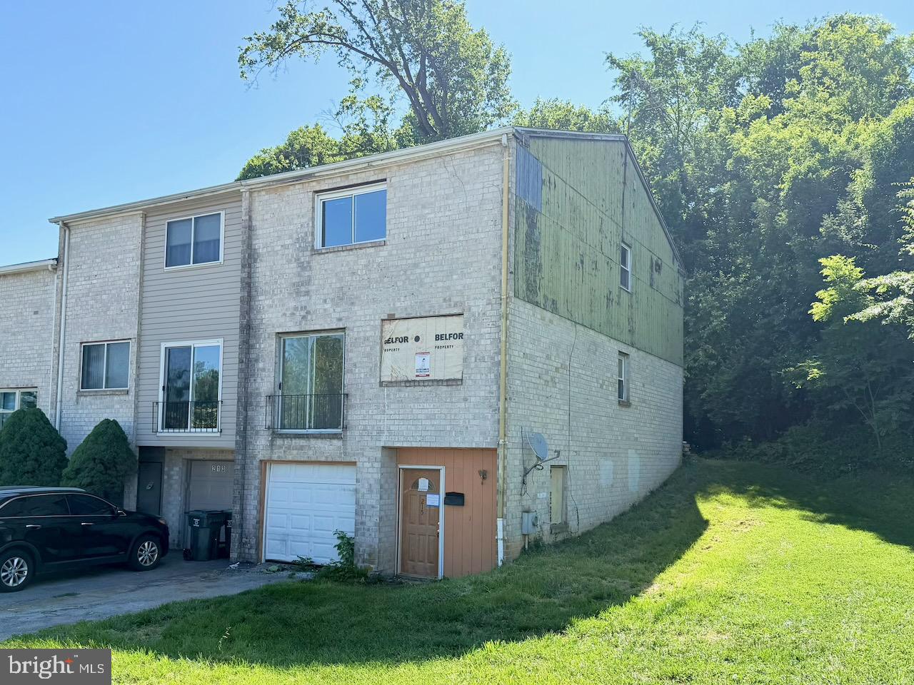 This end-unit townhouse is being sold strictly as-is. The property exhibits significant structural deterioration and deferred restoration, with portions of the exterior secured by protective sheathing. The extent, cause, and scope of damage have not been determined, and buyers should conduct their own investigations. Due to safety concerns and hazardous conditions, interior access is prohibited, and no interior showings will be permitted. Buyers must rely on available photos. The property will require substantial repair, rehabilitation, or possible reconstruction. Cash purchase or specialized financing may be necessary. Property is being sold through ServiceLink Auction. All bids must be submitted through the auction platform. Auction starts July 6, 2026. The sale is subject to a buyer’s premium equal to 5% of the winning bid or $2,500, whichever is greater. Buyer is responsible for conducting all due diligence and reviewing auction terms and conditions before bidding.