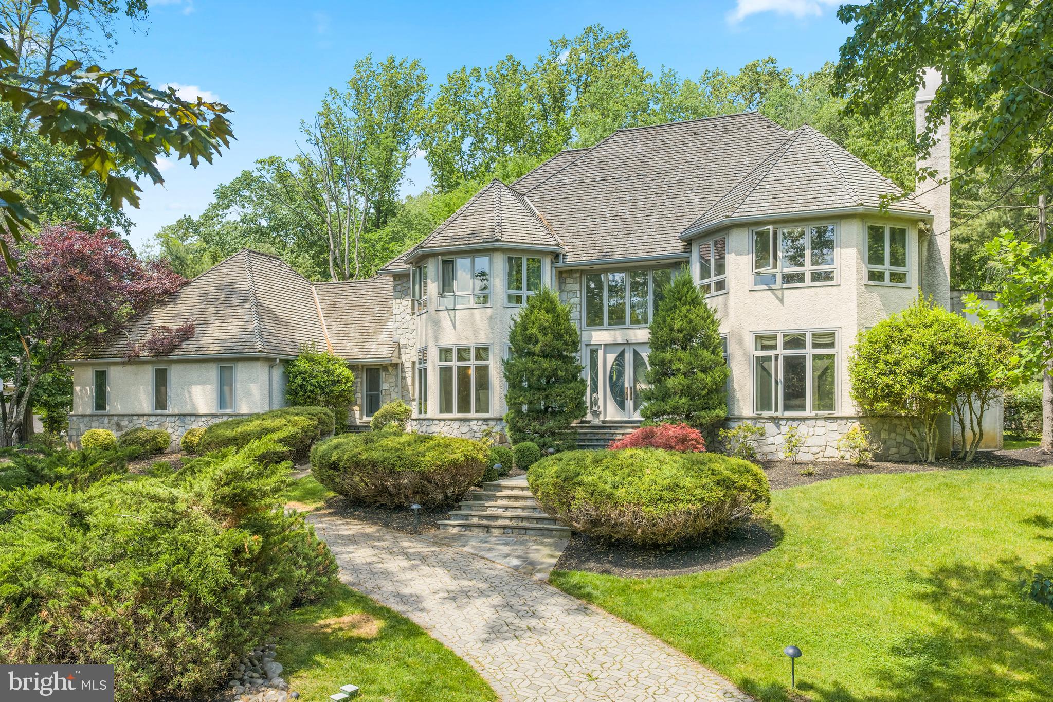 SHOWINGS START THURSDAY....This stately, custom built 5/6 bedroom, 6.5 bath colonial with a contemporary flair and an in-ground POOL and spa is located in the upscale community of "Springton Pointe." This is a great house for multi-generational, in-laws, au-pair or entertaining overnight guests with a separate living suite and full kitchen on the lower level! Enter the dramatic 2-story foyer with gorgeous inlaid Carrera marble flooring and sweeping curved staircase. To the right is a formal living room with hardwood floors, a marble fireplace and wet bar, perfect for entertaining. There is an ideal work-from-home situation in the handsome office/study with 2 built-in desks, bookcases and a coffered ceiling. To the left of the foyer is the formal dining room with crown moldings and large bay window, offering a gorgeous view of the lake in certain seasons. The eat-in kitchen, with radiant heat floors, has a large island with granite countertops, Wolf & Kitchen Aid appliances, built-in new Sub Zero refrigerator, and is open to the family room and breakfast room. The huge windows  in the breakfast room afford an amazing view of the pool and expansive yard. The large family room with vaulted ceiling and marble fireplace is the perfect spot for family gatherings or watching a movie w/the built-in speakers & surround sound. Off the kitchen is a play room or a second office (could be a main floor bedroom if needed) with built-in bookcases. Main floor laundry (with a laundry chute from the second floor) and two half baths complete this floor. The second floor features four bedrooms and three full baths and the third floor has it's own princess/guest suite. The spacious master bedroom boasts it's own marble fireplace and a cathedral ceiling. His and hers walk in closets w/built-in closet systems and a private balcony. The luxurious marble master bathroom includes a jetted tub, large shower, double sinks with make up vanity with radiant heated floors. Two bedrooms share a jack-n-jill full bath with double sinks and one en-suite bedroom with it's own full bath. The third level is perfect for an au pair or teen wanting privacy in their own suite with beautiful marble bathroom w/jetted tub. The huge lower level with 9' ceilings features a new full kitchen with wood cabinets and granite countertops, pool table area, gym, TV hang out area with stone fireplace, a full bath and another spacious room with a closet. A total of over 2600 of living space on lower level. The back yard is an oasis with mature plantings, pool and hot tub. With over 9,000 square feet of living space, this is a great value! A short ride to the Amtrak train station in Paoli with trains to NYC. Conveniently located near Newtown Square shopping, restaurants, Ellis Preserve & Whole Foods. 20 min. to airport, 30 to Phila & 35 min. to Wilmington. Low taxes!