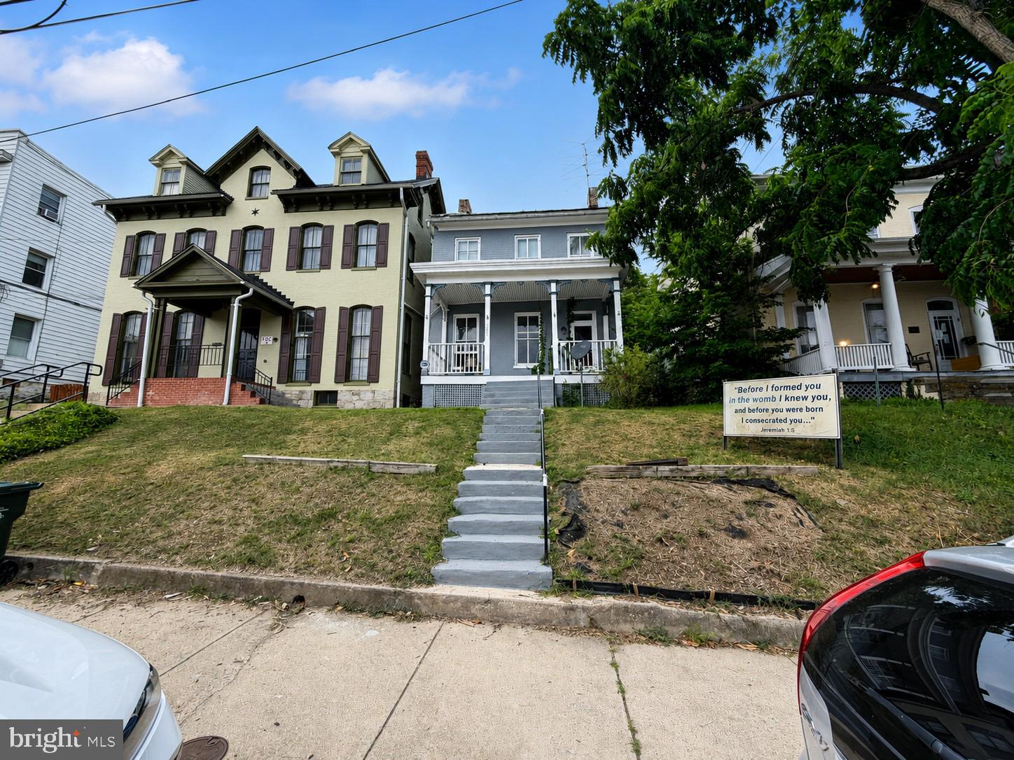 Step into the timeless charm and character of this spacious Victorian-era home featuring 3 bedrooms, 1 full bath, original hardwood floors, elegant crown moldings, and generously sized rooms throughout. Offering over 1,800 square feet of living space, plus a full basement and unfinished attic, this home provides endless possibilities for expansion and customization. Outside, you'll find a large, shaded backyard and a detached 2-car garage, ideal for parking, storage, or a workshop. Located directly across from the new baseball stadium, this property offers outstanding investment potential. Whether you're looking for a place to call home or an income-producing property, the location makes it ideal for both long-term and short-term rentals. Don't miss this opportunity to own a piece of history with incredible potential!