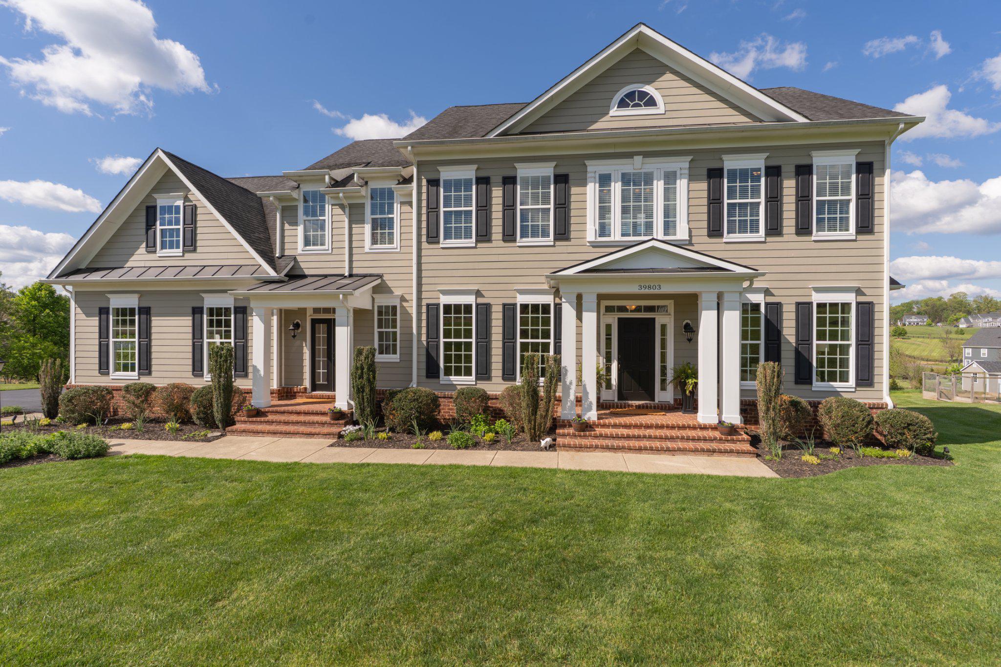 Set on 3.54 private acres in the heart of Western Loudoun County, this exceptional Carrington-built Colonial home delivers a refined balance of luxury, craftsmanship, and everyday livability. Constructed in 2016, the residence reflects thoughtful design, timeless finishes, and meticulous care throughout.

The home, with 6,039 finished square feet, offers five spacious bedrooms and four and a half baths, anchored by a well-appointed gourmet kitchen designed to impress. Featuring an expansive center island, built-in appliances, and generous pantry space, the kitchen opens seamlessly to the breakfast area and inviting family room—creating an ideal environment for both daily living and sophisticated entertaining. 
Hardwood flooring extends throughout the main living areas, complemented by plush carpeting in the family room. Architectural details such as crown molding, chair rail, and recessed lighting add depth and elegance to the interior. The home’s interior is complemented by the panoramic sightlines through every window, including seasonal views of the Catoctin Creek. 

The primary suite is designed as a true retreat, offering a spa-inspired bath with soaking tub, walk-in shower with dual shower heads, and spacious walk-in closets with custom cabinetry. Each additional bedroom is well-proportioned with one bedroom as an ensuite and two additional bedrooms sharing a bathroom. The upper level is serviced by two staircases, one from the foyer and the other from the mudroom.

Outdoors, the property continues to impress. An expansive Trex deck and patio overlook a peaceful open vista, ensuring both privacy and a connection to nature. The covered outdoor pavilion with wood-burning fireplace is an enjoyable space to relax and enjoy the views. The three-car side-entry garage and extended driveway provide ample parking and convenience.

Additional highlights include an expansive lower level with a fifth bedroom and full bathroom and walkout to a stamped concrete patio. The expansive recreation room mimics the floor plan from above. Additional storage can be found in the lower level.

Located Old Wheatland Estates, an established community, the quarterly HOA fee is low and covers basic amenities services such as refuse and recycling. This is a residence that speaks to those who value space, privacy, and quality construction—offering a rare opportunity to secure a distinguished home in one of Loudoun County’s most picturesque settings. Note: Old Wheatland Road to be paved soon from Milltown to Rosemont Farm Pl. VA loan assumption possible for buyer with VA loan.