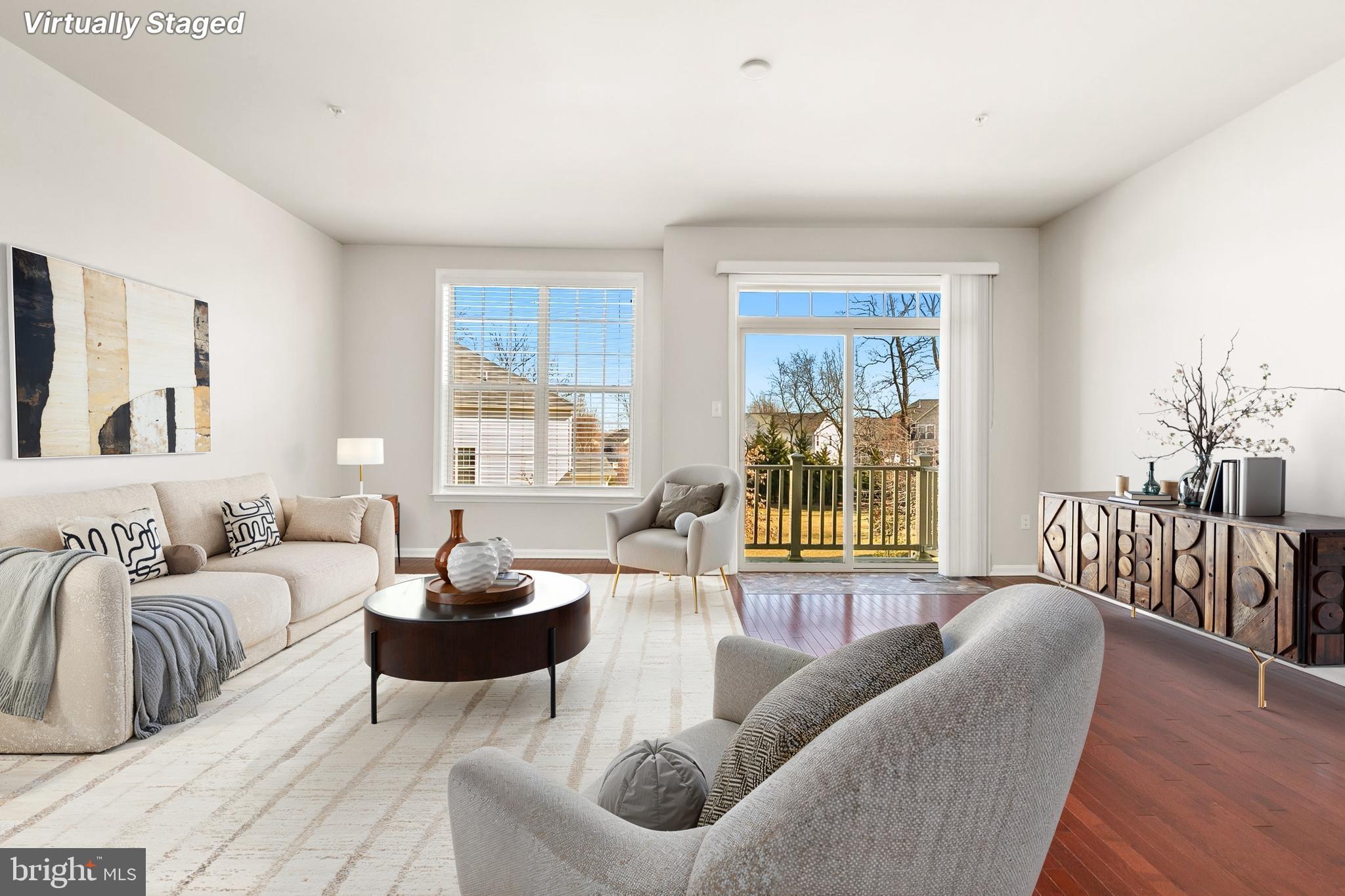 Welcome to this stunning 3-bedroom, 3.5-bath townhome, built in 2018 by renowned builder DR Horton. Thoughtfully designed for modern living, this freshly painted home offers stylish finishes, flexible spaces, and unbeatable convenience. The ground floor opens to a versatile living area with recessed lights and a full bath for added flexibility. Access the rear-entry two-car garage directly from this level, offering secure parking and additional storage. The heart of the home is a bright, open-concept space perfect for both daily living and entertaining. Rich hardwood floors flow throughout the living, dining, and kitchen areas, creating warmth and continuity. The chef’s kitchen is a true standout, featuring granite countertops,  elegant Tahoe Maple Espresso cabinets, and a large island. The living area opens to a rear balcony, perfect for morning coffee. A convenient half bath completes this level. Retreat to the spacious primary suite with a private en-suite bath and a generous walk-in closet. Two additional bedrooms, a well-appointed hall bath, and a laundry area offer convenience and comfort for everyone. Brand-new carpeting on the stairs and throughout the upper bedroom level adds a fresh, cozy touch. This vibrant community offers resort-style amenities designed for recreation and relaxation. Residents enjoy key-fob access control to the clubhouse, a fully equipped fitness gym, and a sparkling community pool—perfect for warm summer days. Outdoor enthusiasts can take advantage of the basketball and tennis courts, with a brand-new pickleball court coming soon, adding even more opportunities for fun and fitness. Ideally situated just off I-495, this home offers easy access to major routes and is only 2.5 miles from the Largo Metro, which makes commuting effortless. It is also conveniently located directly across from Woodmore Shopping Centre, providing endless shopping options, dining, and entertainment.