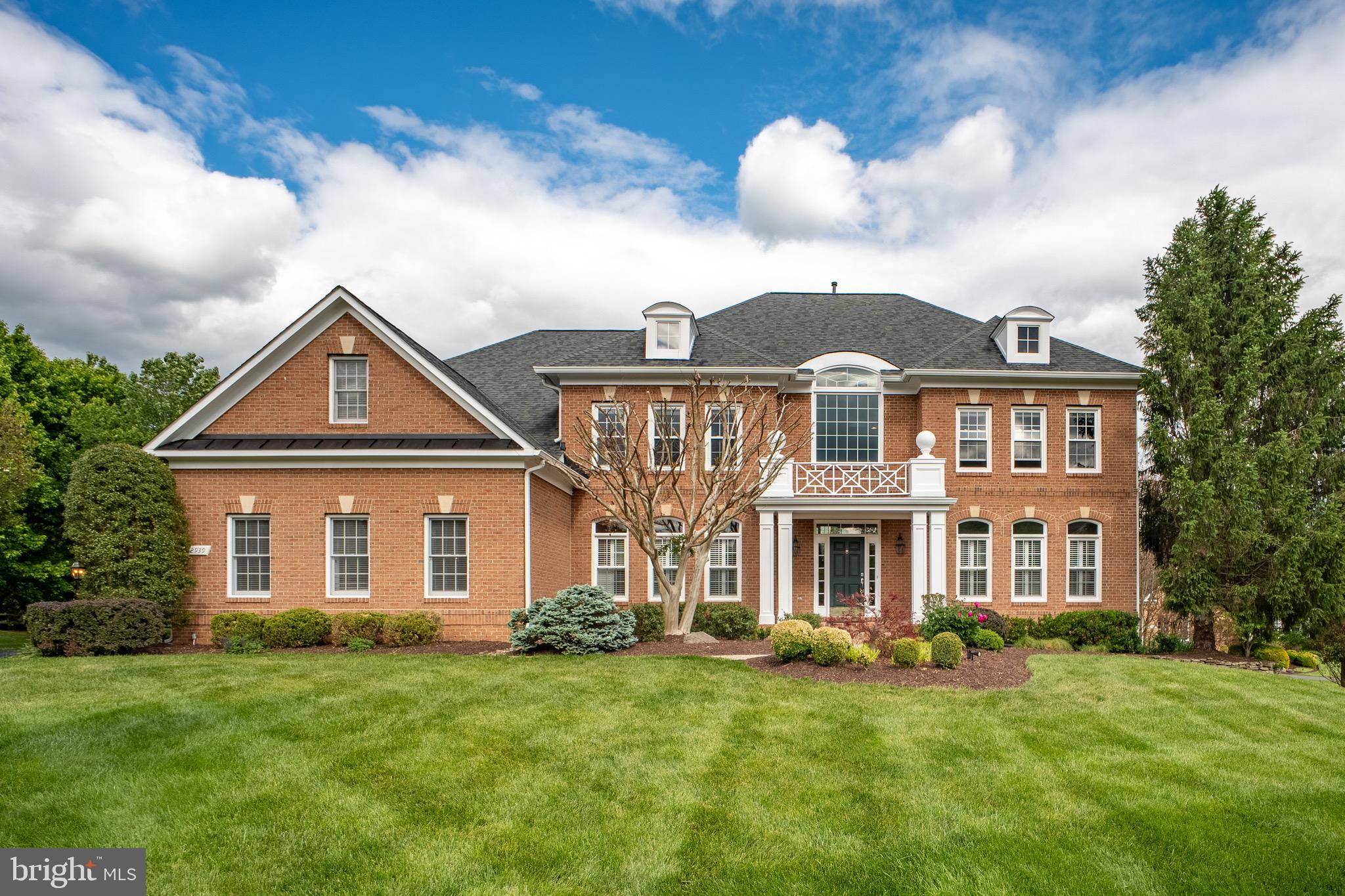 All Offers due by 3pm on Monday 5/18.  Rarely available! This elegant estate home, in sought-after Manors of Fox Mill, offers 5 bedrooms, 4 full baths, and 2 half baths on a FLAT one-acre lot backing to WOODS. Combining timeless design with modern updates,this turnkey residence is ideal for both entertaining and everyday living. A stately three-side brick exterior and three-car garage create impressive curb appeal. Inside, a sweeping dual staircase welcomes you into LIGHT-FILLED living spaces with rich hardwood floors and expansive floor-to-ceiling windows. The gourmet kitchen is equipped with a 48" Sub-Zero refrigerator, a six-burner Wolf gas range, and two Miele dishwashers. The kitchen opens seamlessly to the breakfast room and sunroom, where walls of windows overlook the private backyard. The main level also includes a spacious family room with a gas fireplace, private study, and elegant formal living and dining rooms. Upstairs,the spacious owner’s suite offers a peaceful retreat with a private sitting room, spa-inspired bath, and large walk-in closet. One secondary bedroom includes a private en suite bath, while two additional bedrooms share a Jack-and-Jill bath. The walk-out lower level adds outstanding flexibility with recreation and entertainment space, plus a private fifth bedroom with walk-in closet, and full bath. Outdoor living is equally impressive, with a deck and patio with a fire pit overlooking the flat backyard. Conveniently located near Tysons, Fairfax, Reston, and Dulles, the home offers easy access to shopping, dining, and commuter routes, and all within the highly regarded Oakton High School pyramid. Exceptional combination of luxury, space, privacy, schools, and convenience. MUST SEE! Major updates include:• Primary bathroom (2016)• Kitchen (2017)• Roof (2021)•Gutters (2024)•Water Heater(2024) Second-level and basement flooring (2024)• Most windows replaced (2026)• Driveway (2026).