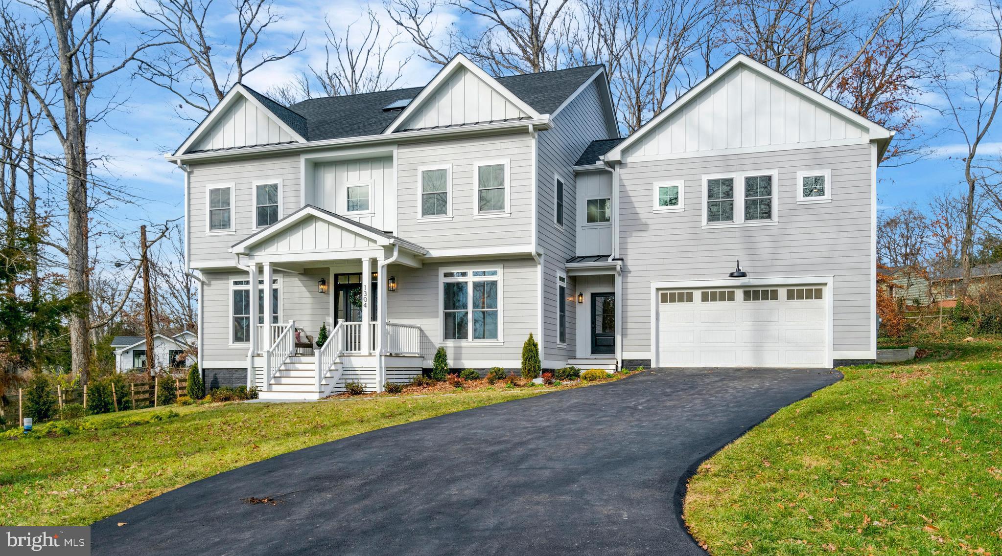 Gorgeous new construction home sits on a half-acre lot and is nestled among mature trees in the beloved NOVA Fort Hunt community in the sought after Waynewood Elementary School District. With over 5,000 square feet of above-grade living space, this one-of-a-kind home offers classic architectural features, lots of upgrades and a fantastic layout. Entering the home through the welcoming covered front porch you will immediately appreciate the beautiful wide-plank hardwood floors, 9 ft ceilings, oversized windows, and open airy feeling. On the right is an office (can easily convert to a formal dining room). On the left is a main floor bedroom with a full ensuite to keep your guests happy in their own private area. As you pass the beautiful staircase, you enter a light-filled expansive kitchen/dining/family room area with a large gas burning fireplace flanked by built-in bookshelves. The oversized sliding glass doors of the family room provide lovely views of the tree-lined backyard. The kitchen features white shaker painted maple cabinets, quartz countertops, tiled backsplash, large farmhouse sink, large island with seating for 4 and plenty of storage. Immediately off the kitchen, you will find a powder room and butler’s pantry with beverage fridge and storage. Adjoining the pantry is a large mudroom with custom built-in cubbies for coats, shoes &. backpacks with access to the garage as well as the front and back yards. Upstairs there are 4 bedrooms plus a huge recreation room (or 5th bedroom with double closets and full ensuite). The owner’s suite, with views of the backyard, has 2 walk-in closets, a gorgeous bathroom with soaking tub, large glass-enclosed shower, and double sinks. Bedroom #1 has a private ensuite; bedrooms #2 & #3 share a Jack n Jill bathroom with a double sink vanity.  Other second floor features include a laundry room with custom cabinetry, walk-in storage closet and even space for a future elevator! You'll never have to leave this beautiful home. But wait, there's another level! You have the option of customizing the 3rd floor. You can add another bathroom, maybe even a sauna-make it whatever your heart desires! Finally, let's face it, one of the most important spaces in anyone's dream home is a good-sized attached garage. This finished garage easily fits 2 cars and is wired to charge your electric car! This home features many upgrades such as 2 separate Carrier Heating/Air Conditioning zoned systems, tankless water heater with infinite hot water, CAT-6 wiring with multimedia outlets, Hardie-plank siding, lifetime architectural shingled roof with metal roof accents, and a dedicated natural gas hookup for grilling. WFB Companies Inc. and Crafted Architecture have designed a home you will not want to leave. But should you have to, you are a block away from the wonderful shops and restaurants of Hollin Hall Village, including the famous Variety Store and Village Hardware! The home is in the Tauxemont Village Community which is a Cooperative not an HOA. The Cooperative manages the well water system, 3 parks, nature trail and tennis court. Homeowners can also access the Tauxemont school playground. Cost is $700 annually which includes water. You can access Tauxement Park by a path just one house over. There is a path up between the hosues so no need to go on busy roads! Beyond that you will also find lots of parks, pools, and pickle ball courts nearby, including the wonderful Mount Vernon Park with pool, pond, tennis courts and pavilion. Bring your fishing rod. Even though you will feel far away from urban mayhem, you are minutes from the George Washington Parkway with its beautiful views of the Potomac River, biking and walking path, easy access to Old Town, Hwy 495, Reagan International Airport. Don't miss out on this truly special new home.