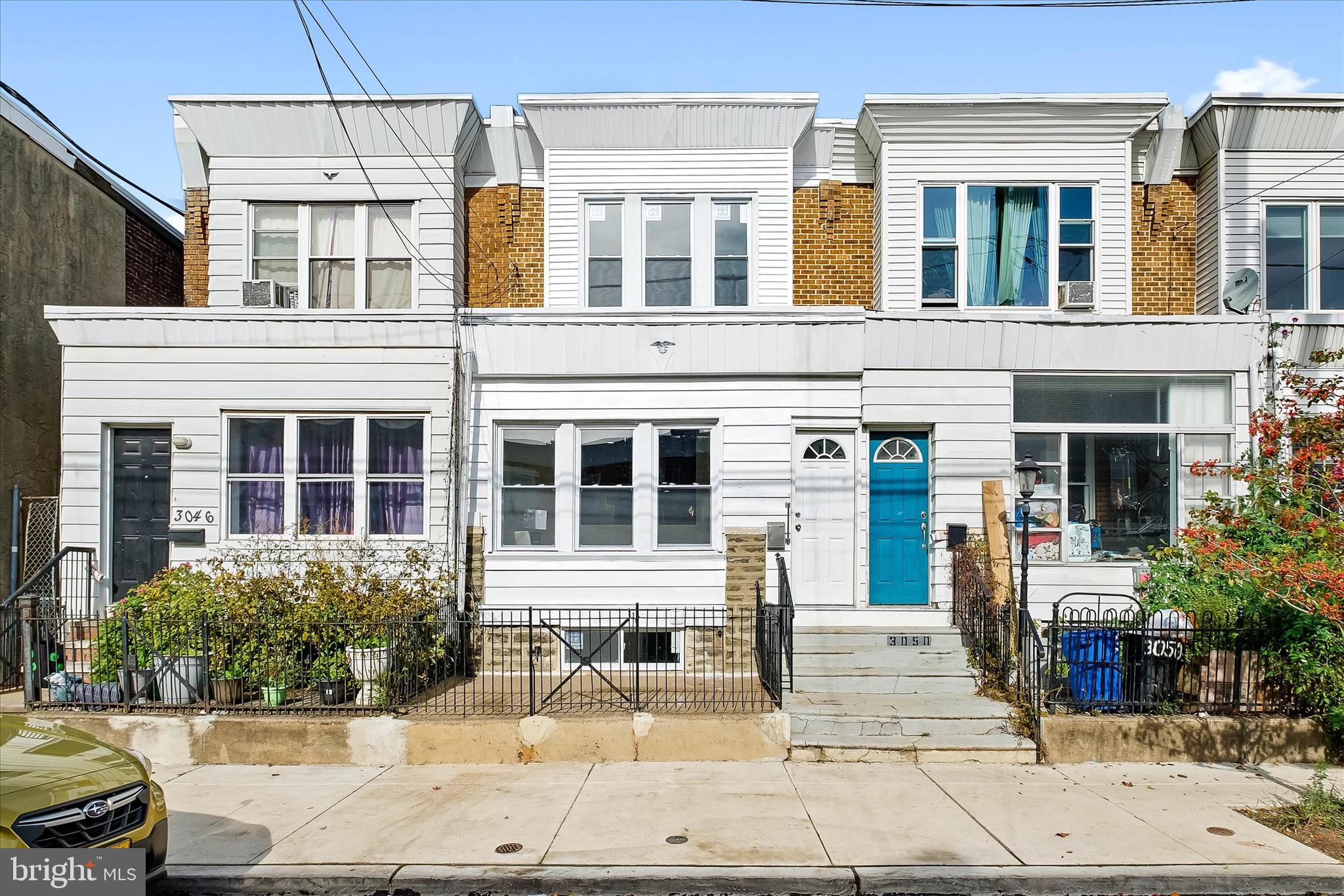 HUGE PRICE DECREASE! You will not find a nicer remodeled home in this area! Come see this completely renovated 3 bedroom, 2.5 bath home in Port Richmond! You will be welcomed by its great curb appeal and four season porch with amazing natural light that flows gracefully into the spacious open concept floor plan. And, with new vinyl plank flooring, open custom-designed stairwell, and recessed lighting, this main floor is sure to impress! There is even a built-in wall fireplace, an architectural TV wall area and picture frame nooks, all with colored lighting that you can change from an app on your phone! The kitchen and dining area are equally impressive with plenty of lighting, new stainless steel appliances, a gorgeous honeycomb backsplash, and granite countertops complete with a breakfast bar. Also on the first floor is a completely redone full bathroom with a convenient stall shower. Upstairs you will find three nicely-sized bedrooms with new flooring and plenty of closet space, as well as another renovated full bathroom with a stall shower, that awesome vintage Philly skylight, and an exhaust fan with bluetooth for listening to your favorite music! Downstairs there is even more living space available, with a brand new half bathroom and laundry area, that is just waiting for you to make it your new rec room, man cave, office, or even 4th bedroom. And, outside, you will love the large deck and vinyl privacy fencing! Other notable features of this great home include: new central air (2022), new windows throughout (2022), and a newly coated roof (2022). So call today for your private showing, you will not be disappointed!