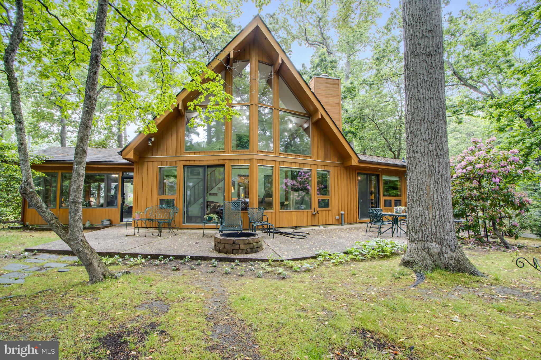 This shovel-ready 0.5-acre property is located in the popular community of Henlopen Acres. Nestled between the Lewes-Rehoboth Canal and the Atlantic Ocean, you’ll find a rare, wooded, triangular lot just ready to bring all of your coastal dreams to life. Approved plans feature a 6-bedroom, 6.5-bath luxury home with a private pool, bunk room, office, open floor plan and two-car garage. Residents of Henlopen Acres enjoy access to a private beach and marina, offering a seamless blend of seclusion and recreation right at their doorstep. For those seeking even more, an optional Beach Club membership provides access to resort-style amenities, including tennis courts and dedicated beach services. * Pictures are renderings of new home to be built - plans and permits available upon request. Pictures of existing home available upon request. MLS details are of existing residence not the home to be built.*