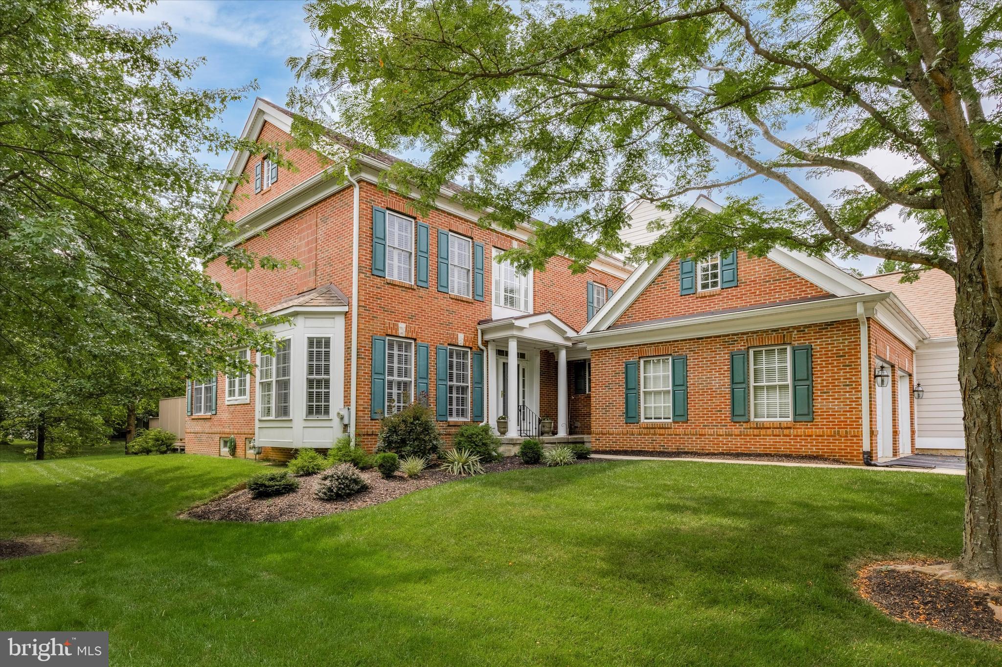 Welcome to 300 Arthur Court located in the sought after community of Springton Pointe Woods, Newtown Square. The 4-bedroom, 3 full baths ,2 powder room, two car garage end unit carriage home is in impeccable condition with many beautiful upgrades throughout the three levels,5000 plus square feet of living area. As you enter the foyer, there is a stunning spiral staircase and open floorplan featuring a two-story Great Room with gas fireplace built in wall cabinets and extensive millwork. There is a formal Dining Room with wainscoting and crown molding that leads into a gourmet eat in kitchen with pantry and breakfast sitting area that overlooks the back deck (with electric awning) and yard.  There are hardwood floors throughout the majority of the first floor and plenty of natural sunlight shining through the many windows. All windows have planation shutter shades. The first-floor master bedroom with master bath has a shower stall, soaking tub and new double sink vanity and granite countertops. The laundry room with garage access and powder room complete the first floor living area. The second floor has three additional bedrooms plus an open den/office loft area with built in cabinets and shelves that overlooks the first floor. One of the bedrooms has a private bath. There is a jack and jill hall bath that serves the two other bedrooms.  The lower level with walk out is finished offering additional living and entertaining areas. It features a large family room area, full-service kitchen, powder room plus storage space. Both HVAC systems and hot water heater are newer. Conveniently located close to the many shops, boutiques, and amenities available to Newtown Square residents.
