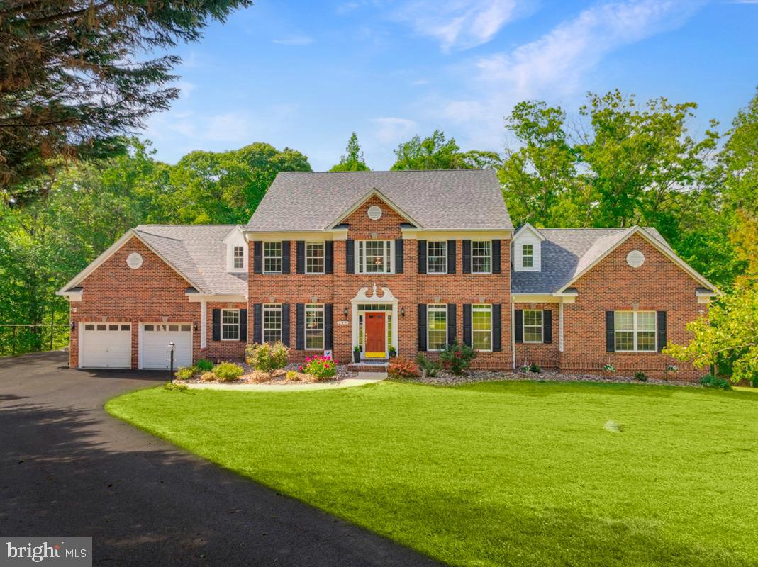 **Open Sunday 6/7 2-4pm** Stately Northern Calvert brick front estate on almost 8 acres overlooking your own creek for under $1 million.  Tucked away on a private cul de sac, this sprawling 6 bedroom,  6 bath,  6,500 sq. ft custom built colonial home offers room to roam on three levels and endless possibility. 

The main level of the home welcomes you with a two story foyer and commanding staircase flowing into formal living and dining rooms with lots of natural light and high ceilings.  Spacious family room with cathedral ceilings, an impressive stone fireplace and an enchanting wall of windows overlooking your own private forest and creek.  Well apportioned eat-in gourmet kitchen with all new white glass appliances and brushed light wood cabinets, separate laundry room and convenient half baths located off kitchen and family room.  Newly installed LVP flooring on three levels and new carpet in primary bedroom. 

Massive main level primary bedroom suite and secondary bedroom on main floor offer attractive main level living options.  The oversized primary bedroom suite offers two walk in closets, spacious bathroom with walk-in shower and separate soaking tub and a seating area and office.  Grand staircase leads to three spacious bedrooms upstairs with 2 full baths along an open catwalk overlooking the family room and foyer. 

Newly completed, fully finished 2,500 sq. ft. lower level lives like a separate home. Designed with a large living area that can be easily divided for a studio or classroom, in place plumbing hook ups for a kitchen and wet bar, spacious bedroom, full bath with walk in shower, home theatre area, fitness area, and storage.  Perfect for multi-generational living, au pair suite and home office, the lower level also offers strong rental potential.  The possibilities are endless in this vast light and bright space with loads of windows and exterior egress.  

Extra deep two car garage, paved RV and Boat parking alongside home and plenty of driveway parking.  Seasonal hunting on the property is permissible.  Relax around a fire pit, enjoy the creek and the gentle peace of the surrounding nature.  Top rated, blue ribbon Calvert County schools. 

Outdoor recreation opportunities abound.  Minutes to Chesapeake Beach on the Bay and North Beach offering dining, shopping, boardwalks, and nationally recognized marinas. Several regional parks and the Patuxent River are only a few miles away.  Unbeatable convenience to Joint Base Andrews, Washington D.C. and Annapolis.