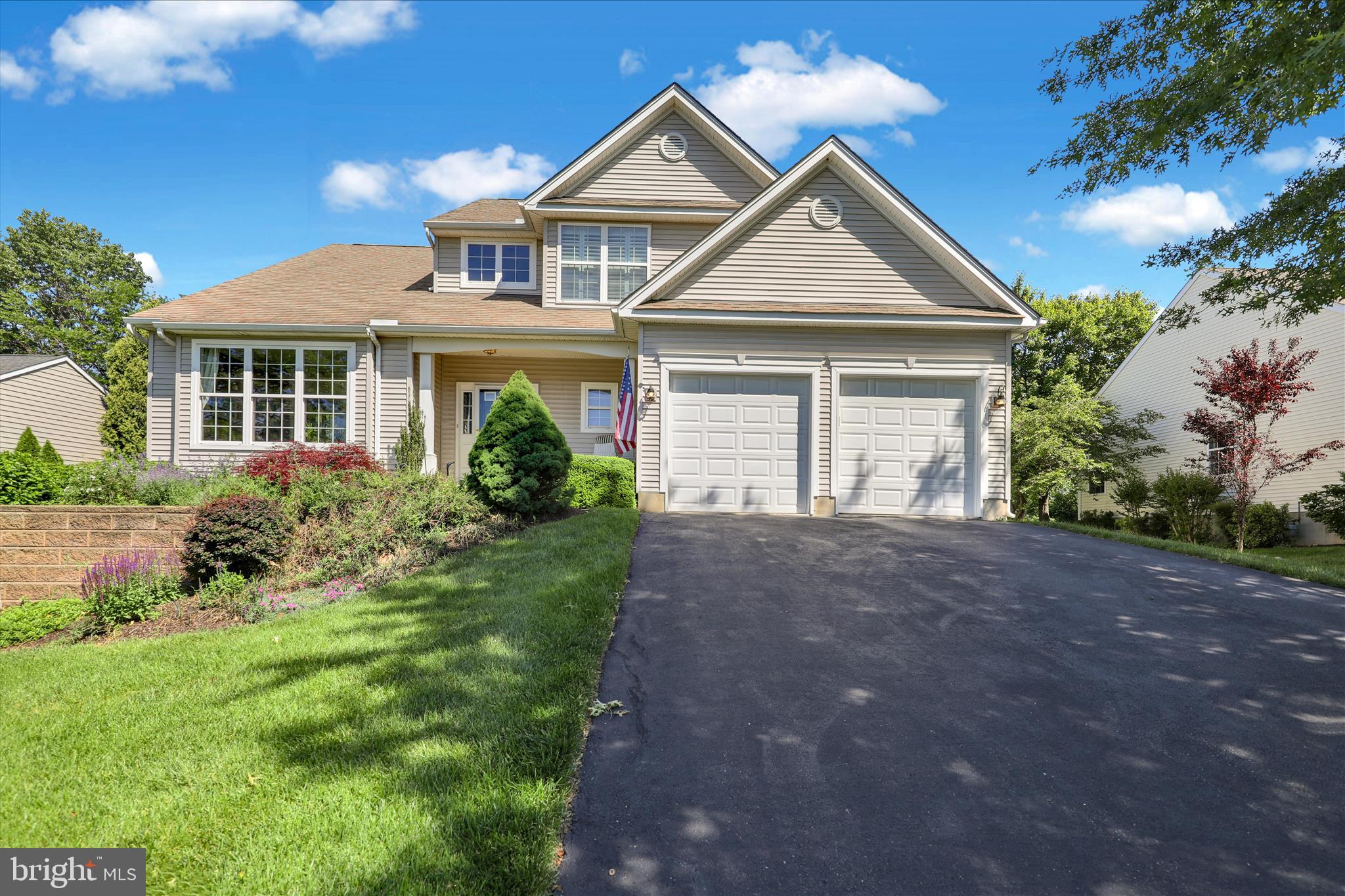 Welcome to Traditions at Inniscrone, a beautifully maintained 55+ community known for its peaceful setting, thoughtful amenities, and inviting atmosphere. This traditional style home, built in 2005, offers 2,781 finished square feet designed for comfort, connection, and easy everyday living. Step inside to an open layout that flows naturally from one space to the next. Hardwood floors and soft carpeting create a warm foundation, while the living area becomes a true gathering spot with its gas fireplace framed in marble. It is the perfect place to unwind on cooler evenings. The kitchen is both stylish and practical, featuring stainless steel appliances, a built in microwave, a self cleaning oven, a dishwasher, and beautiful granite countertops. Whether preparing a quiet meal or hosting guests, this space supports it all with ease. A wonderful highlight of the home is the first floor primary ensuite. This spacious retreat offers comfort and convenience with its private bathroom and easy access to the main living areas, creating a peaceful place to begin and end each day. The finished daylight basement adds even more versatility to the home. Bright natural light fills the space, making it ideal for recreation, hobbies, or a second living area. A convenient half bathroom and generous storage areas make this level both functional and flexible. Upstairs, two additional bedrooms and a full bathroom provide room for guests, hobbies, or flexible living arrangements. Every space feels comfortable and well planned. The exterior of the home brings charm and convenience together with low maintenance vinyl siding and stone retaining walls. Enjoy time outdoors on the porch or patio, or take a peaceful walk through the community’s open common grounds. The property backs to a wide open shared area, offering a sense of space and calm, while views of the nearby golf course create a picturesque backdrop. Life at Traditions at Inniscrone is enriched by a wonderful selection of amenities, including a community center, an exercise room, a game room, and an outdoor pool. The association fee covers lawn care, snow removal, and trash collection, giving you more time to enjoy the things that matter most. The location provides easy access to parks, schools, and local services, making it simple to stay connected and engaged. Whether you enjoy quiet walks, community events, or simply relaxing at home, this setting supports a full and enjoyable lifestyle. With an attached garage and ample driveway parking, everyday convenience is built right in. This home in Traditions at Inniscrone offers comfort, charm, and a wonderful sense of place. It is a space where lasting memories can be made and a lifestyle can truly flourish.