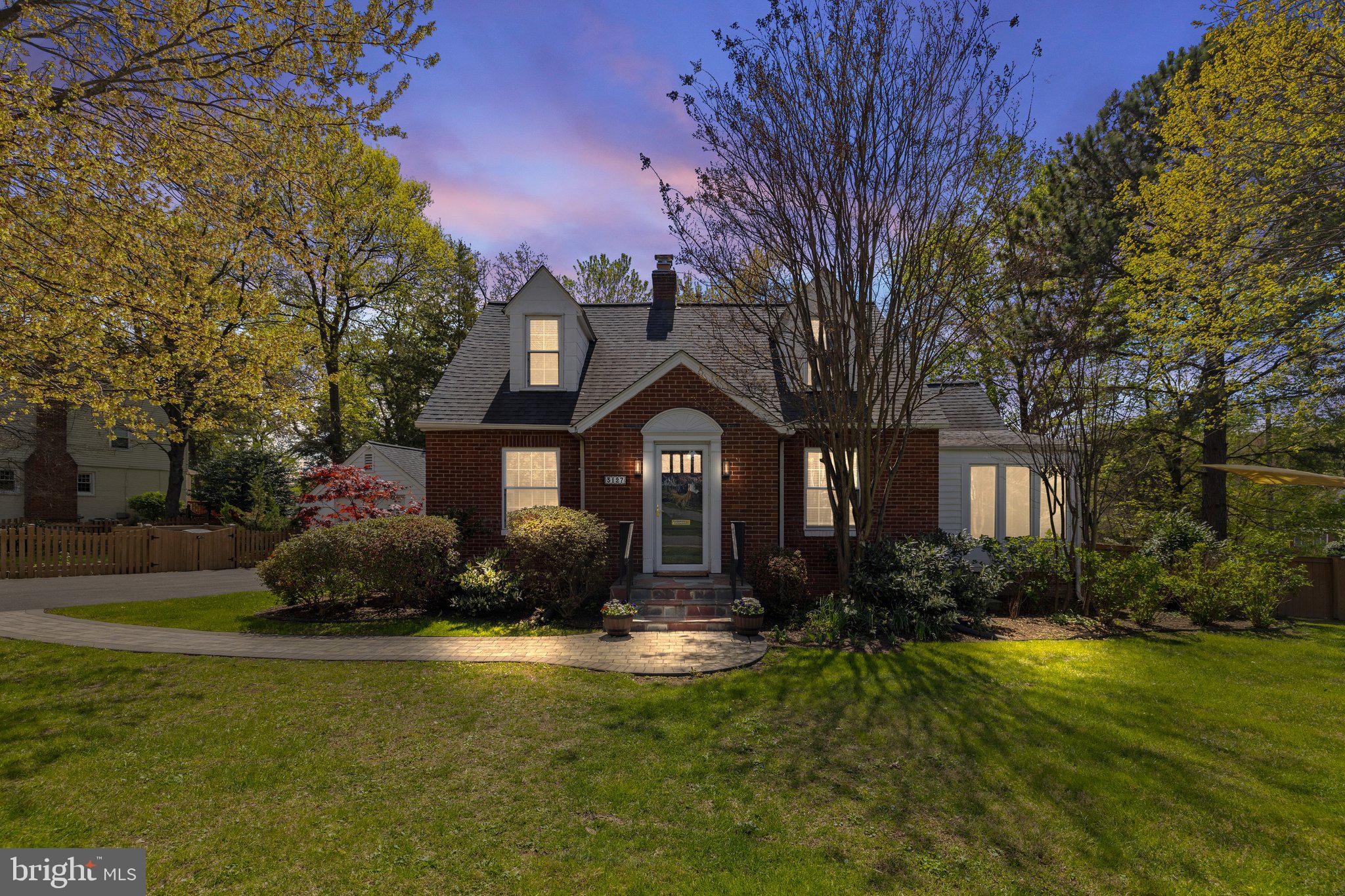 **OFFERS DUE 10am Monday** The beauty and charm of this fully renovated Cape Cod in Lee Heights begin with the curb appeal of its picturesque corner lot. Mature trees, vibrant gardens, a vast flagstone patio, and a stunning fire pit area create a welcoming outdoor oasis that’s perfect for entertaining or unwinding.

Inside, the main level is bathed in natural light and features refinished hardwood floors throughout. The fully remodeled kitchen (2022) offers quartz countertops, a designer backsplash, high-quality white shaker cabinets, and stainless steel appliances. Just off the kitchen is a multi-season sunroom/breakfast nook—an ideal spot to enjoy your morning coffee as the sun rises or sets.

A spacious main-level owner’s suite includes floor-to-ceiling windows and custom wardrobe closets, just steps from a fully remodeled full bathroom (2024) with elegant finishes and beautiful natural light. The large family room is anchored by a wood-burning fireplace with brick surround, flanked by custom built-ins and an oversized bay window—perfect for cozy winter evenings. A formal dining room offers the ideal setting for holiday gatherings and special meals.

Upstairs features two generous bedrooms, each with multiple closets and plenty of character. The primary upstairs bedroom boasts whimsical built-ins under the eaves and three closets, while the second bedroom offers a cozy window seat, two closets (one deep enough for dual dressers), and an enchanting hidden playroom.

The finished walk-up lower level provides flexible space for every lifestyle: a rec room ideal for movie nights, a home office or gym area, a bedroom/den, a renovated full bath, laundry area, and abundant storage.

The fully fenced backyard offers something for everyone. Whether you’re grilling on the expansive patio, lounging with friends, or watching kids and pets play on the grassy lawn, this space delivers. Lush native gardens are filled with wildflowers, hydrangeas, Crepe Myrtle trees, and Skip Laurels, creating a true nature lover’s sanctuary. A detached garage offers space for parking, woodworking, or at-home gym. 

The close-knit community is filled with warmth and tradition—neighborhood potlucks, Oktoberfest celebrations, mom’s wine nights, and a beloved 4th of July parade complete with a firetruck make this a special place to call home. Just a short walk away, explore two parks and a scenic creek for outdoor adventures.

Conveniently located with easy access to Routes 50, 66, and 495, and just minutes to DC, Mosaic District, and the City of Falls Church.

Please refer to the attached “Upgrades List” for a full breakdown of renovations and system updates.