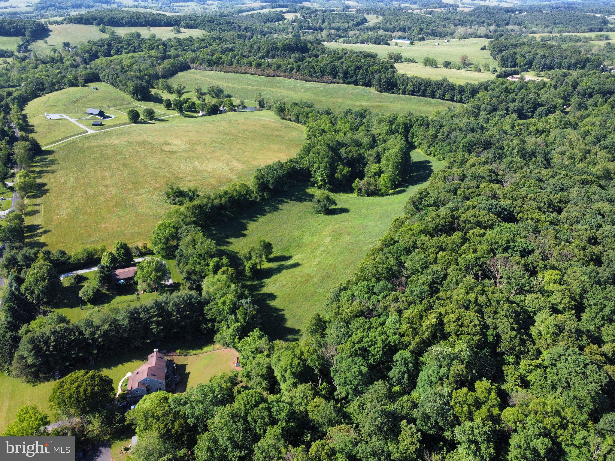 This 26-acre private oasis in East Fallowfield Township offers a rare opportunity to build a custom estate within the prestigious Cheshire Hunt Country of Southern Chester County. Accessed via a private lane exceeding 300 feet, the property reveals a serene landscape of rolling pastures and mature woodlands that slope into a verdant valley. A natural spring at the southern end feeds into the Buck Run, enhancing the site's tranquil atmosphere. While providing a completely secluded retreat, the location remains exceptionally convenient to major regional hubs. It offers easy access to Amtrak and SEPTA rail lines and is centrally positioned for commuting to Wilmington, Philadelphia, Lancaster, and the I-95 corridor.
Easement Overview:
The property is protected by a Brandywine Conservancy Easement, ensuring the preservation of its pastoral character while offering flexible development options.
Permitted Uses per the Brandywine Conservancy Easement: Agriculture and livestock activities are explicitly permitted.
Residential Dwelling: Allows for one primary residence of up to 10,000 square feet of habitable floor space.
Accessory Dwelling: An attached apartment of up to 1,000 square feet is also permitted.
Second Residential Dwelling: Allows for one secondary residence of up to 1,500 square feet of habitable floor space.
Impervious Coverage: The easement allows for up to 22,000 square feet of total impervious coverage, accommodating both residential and agricultural needs.
This property represents a perfect synergy of privacy, accessibility, and conservation-minded development potential in one of Pennsylvania's most beautiful regions.