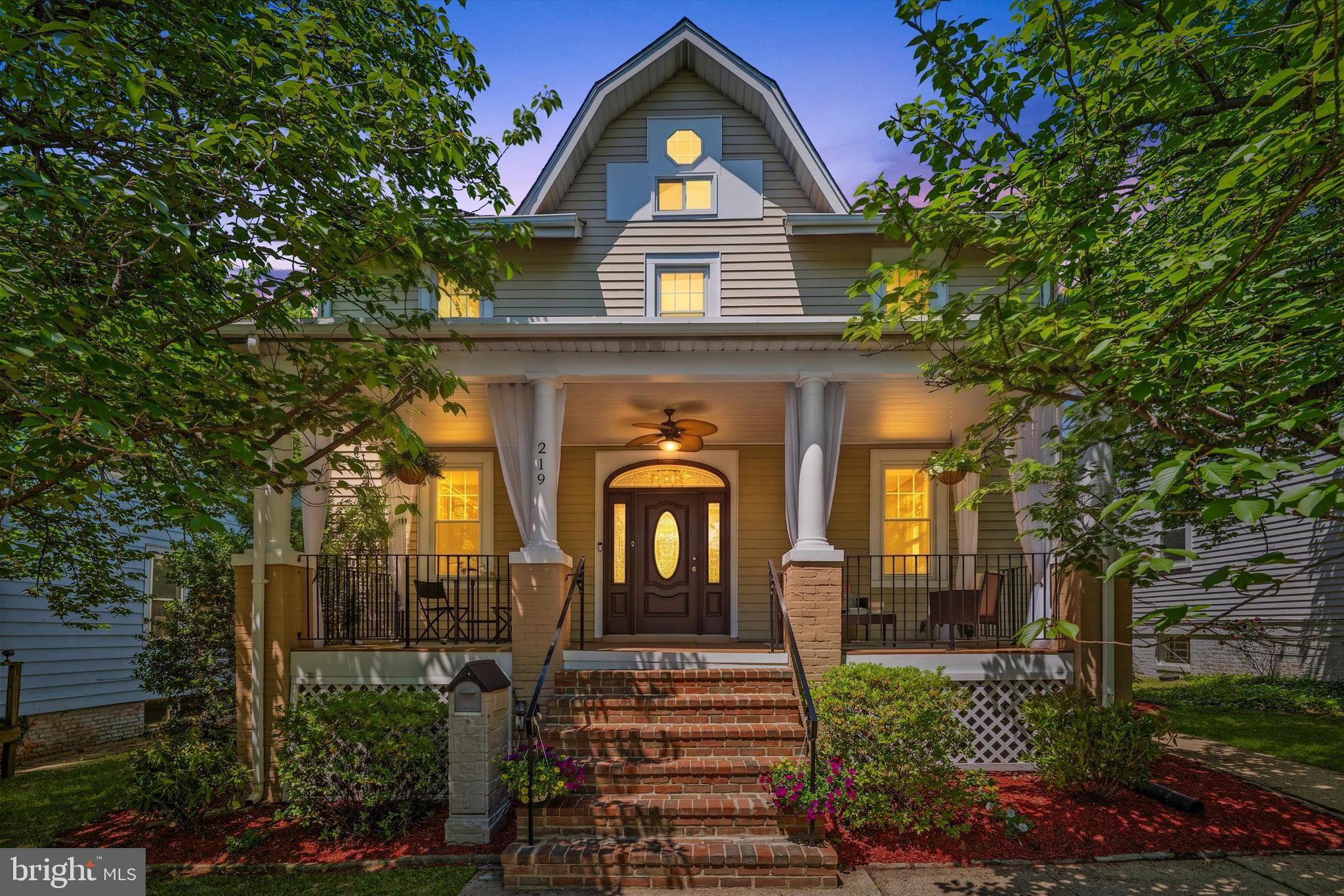 $90,000 Price Adjustment — Timeless Elegance, Exceptional New Value
Thoughtfully repositioned to align with today's market, this distinguished residence now presents an even more compelling opportunity. From its gracious living spaces and refined architectural details to its warmth, charm, and effortless livability, this home balances classic elegance with modern comfort in a way that is both rare and enduring. 
Set on a rare double lot, this stately 1918 Craftsman is a home of enduring beauty, timeless character, and quiet distinction. Framed by a canopy of magnificent cherry blossoms bursting into a kaleidoscope of spring colour, a gracious full-width porch welcomes you home—an enchanting setting for slow mornings, evening conversations, and the soothing rhythm of summer rain, just as it has for generations before.
Spanning four thoughtfully designed levels, the home offers five bedrooms, 4.5 baths, and nearly 3,000 square feet of richly detailed living space. Diamond-pane doors open to an elegant foyer where original millwork and refined craftsmanship immediately set the tone. A superb formal dining room and an exceptionally chic living room with a log-burning fireplace create refined yet inviting spaces for both entertaining and everyday living. The living and dining rooms flow seamlessly through a classic Craftsman colonnade, accented by beautifully refinished hardwood floors that continue throughout the main level and staircase.
At the heart of the home, the expansive kitchen and dining area is flooded with natural light and designed for both effortless daily living and elegant entertaining. Generous counters and a central island create a welcoming gathering space, while opening up to a sun-drenched porch that beautifully blurs the line between indoors and out.
Upstairs, a bright and airy landing introduces the private quarters, including the serene primary suite and a charming guest bedroom with direct access to the railed upper porch. An additional bedroom and guest bathroom complete the level.  The top floor reveals yet another enchanting bedroom tucked beneath the eaves.
The superb lower level extends the home’s versatility with a spacious family or bonus room, a full-size kitchen with exterior entrance, an additional bedroom, a luxurious roll top bath, and a second laundry—ideal for guests, an au pair, creative pursuits, or a potential rental opportunity.
Outdoors, the gardens and grounds embrace the exceptional double lot, offering rare space, privacy, and tranquility in one of the area’s most beloved settings. Just moments from the Historic District’s cafés, boutiques, dining, and year-round farmers market, and conveniently close to the Washington Metro Red Line, Sligo Creek Trail, and the Metropolitan Branch Trail, this exceptional home also offers swift access to downtown Washington via North Capitol, 16th Street NW, and Georgia Avenue.

A rare offering where timeless elegance, historic provenance, and modern livability come beautifully together.