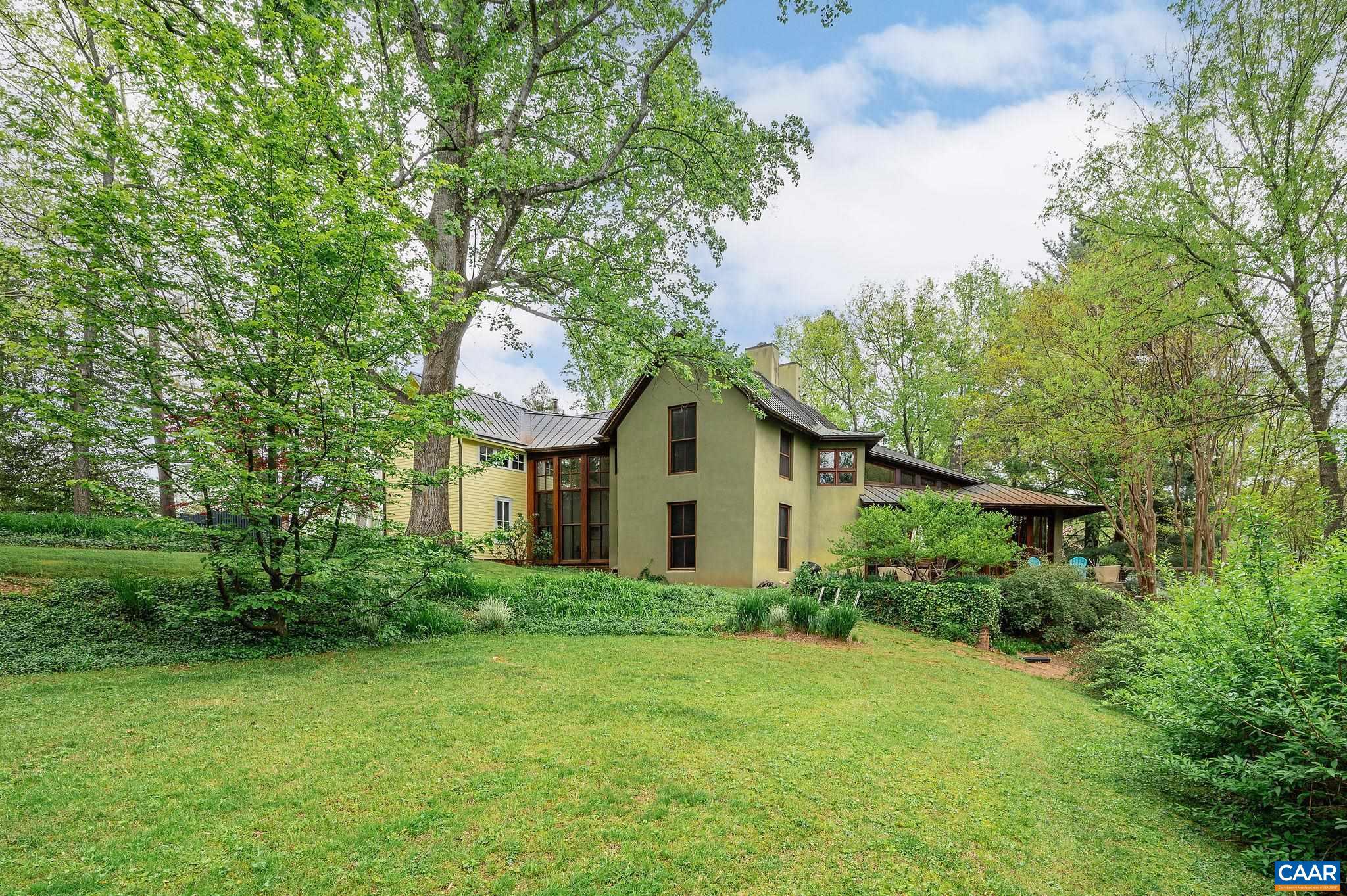 Historic house meets architectural masterpiece in this unique offering. The owner/architects have taken one of the original stately Cville homes from 1870 & brought the outdoors into the house. Keeping the charm at the front with original moldings & windows, the 2 story addition flows seamlessly to the backyard. This newer build has floor to ceiling Spanish cedar windows with stunning views of the 1.1 acre manicured lawn. This park-like setting is lush with mature plantings & historic Oaks & Tulip Poplars. The heart of the house has accordion doors that open completely to a Sapele deck overlooking the 6.5 acres of green space at Davis Park. Seasonal mountain views in North Downtown CVille. Baths include Italian glass tile, Waterworks soaking tub & Dornbracht faucets.  The Kitchen includes custom cabinetry, separate bar and large pantry.  Soapstone counters, Subzero refrigerator. Private concrete pool with Bluestone terrace. 1 car garage.,Soapstone Counter