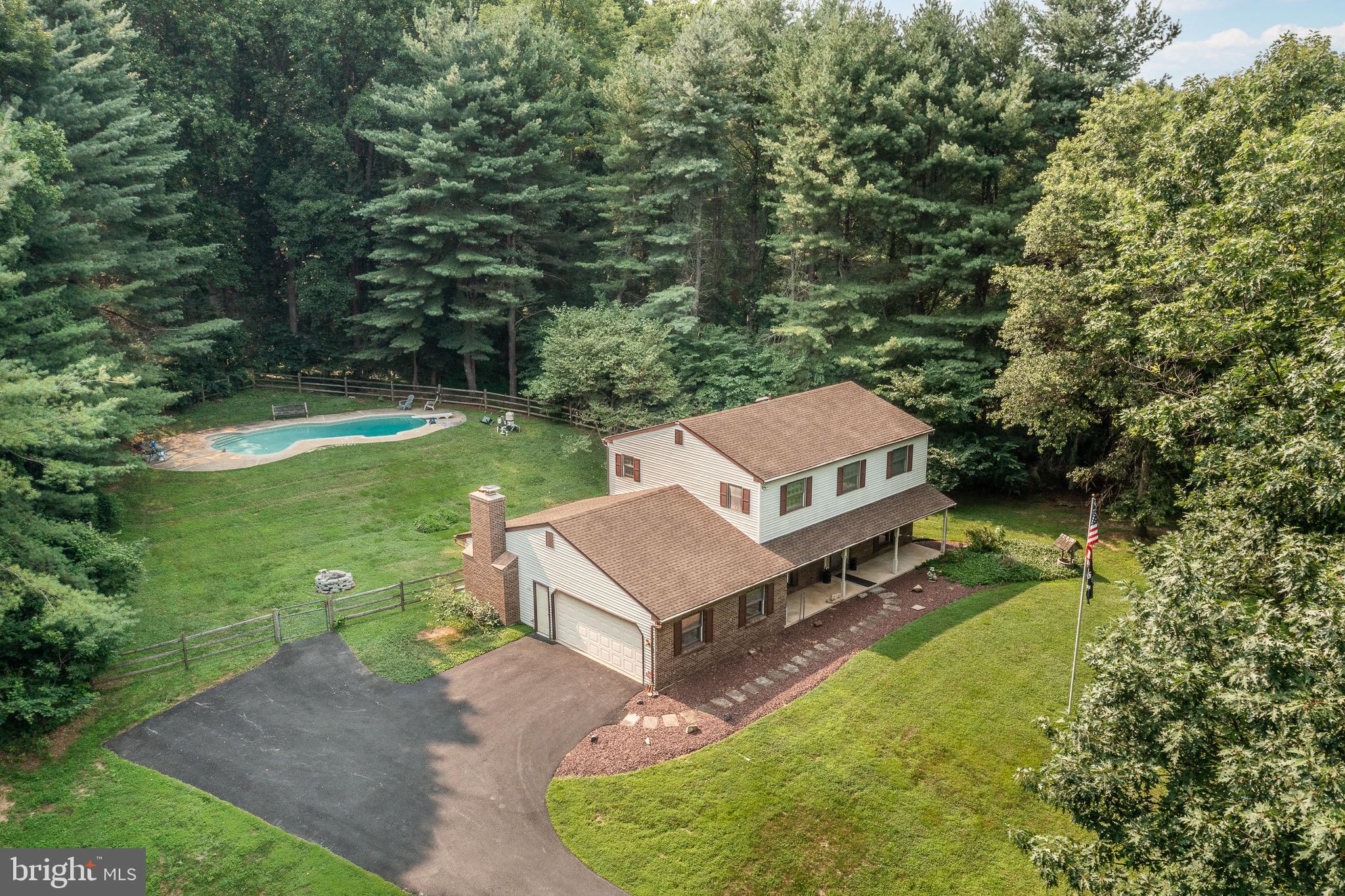 Welcome to your own private retreat in the highly sought-after Unionville-Chadds Ford School District! Nestled on 3 picturesque acres, this spacious 4-bedroom, 2.5-bath home offers the perfect blend of privacy, comfort, and year-round entertainment.

Step inside to find fresh new carpet and a warm, inviting layout featuring a cozy wood-burning fireplace with a wood stove insert, pocket doors off the kitchen, and comfortable living spaces designed for everyday living. The kitchen comes complete with the refrigerator, microwave, water cooler, and all appliances, and it is ready for your updates. 

Outside, you'll fall in love with the impressive 25,000-gallon in-ground pool, professionally maintained by Aqua Authority with recently replaced filters. Whether you're hosting summer gatherings or enjoying a quiet afternoon, this backyard oasis is ready to enjoy. The sale also includes the pool equipment and filters, making ownership even more convenient.

The finished entertainment spaces continue indoors, where the pool table and ping-pong table are included, creating the perfect setup for family fun and entertaining guests.

Additional highlights include:

* New carpet in the den and upstairs
* Roof replaced in 2015
* HVAC system approximately 6 years old
* Central air conditioning
* Heat pump with oil backup heat
* Central alarm system
* Storage shed included with a 40-foot ladder

Offering a rare combination of acreage, recreational amenities, and thoughtful inclusions, this property provides an exceptional opportunity to enjoy peaceful country living while remaining convenient to shopping, dining, parks, and major commuting routes.

Schedule your private tour today and experience everything this incredible property has to offer!