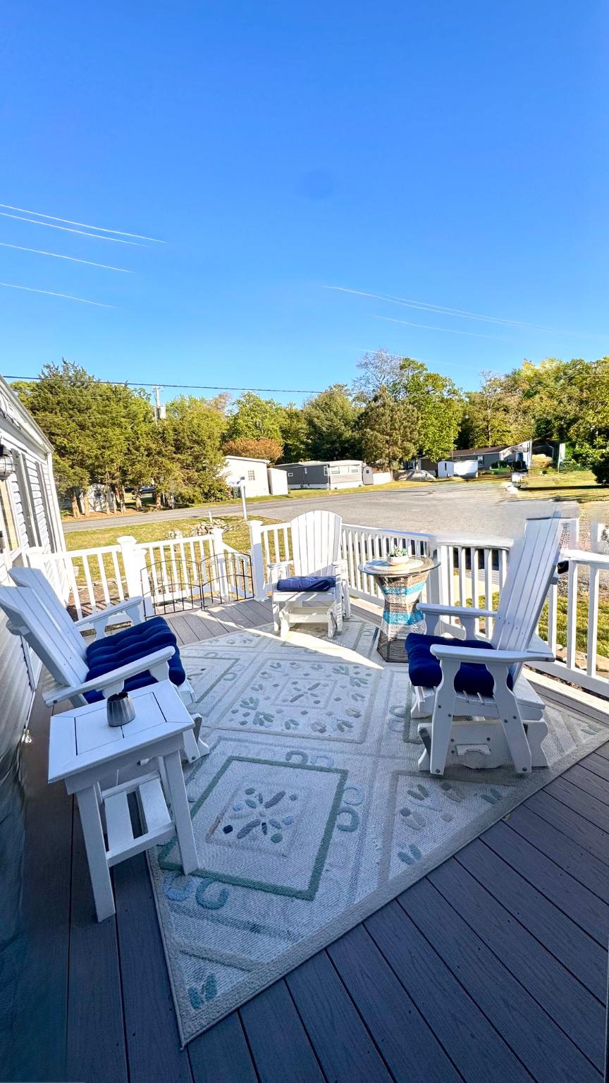 Welcome to Shady Park, a friendly all ages community in Selbyville, DE, known for its welcoming atmosphere and active community events with a voluntary HOA. This charming 2 bedroom, 2 full bath home is located on a corner lot and features coastal décor and a bright, airy layout with1,120 sq. ft. of interior living space, which includes the 140 sq. ft. sunroom, perfect for enjoying morning coffee or relaxing year round in natural light. Step outside to the 120 sq. ft. deck, complete with an automatic awning, ideal for outdoor dining and entertaining. Additional features include a two door storage shed for tools, bikes, or beach gear.
Shady Park offers water access to Dirickson Creek, which flows directly into Little Assawoman Bay featuring a boat ramp and kayak launch, along with a picnic area and water views, providing residents with direct water-oriented recreation.
This partially furnished home offers comfortable, low maintenance living just minutes from area beaches, shopping, dining, and medical facilities—this home is perfect as a primary residence or coastal getaway.
Just minutes away, Bayside Marketplace serves as the area’s premier neighborhood shopping destination, anchored by Harris Teeter and complemented by upscale conveniences including Starbucks, wine and spirits, specialty dining, banking, and personal services—all with the benefit of Delaware’s tax free shopping.  Residents also enjoy nearby access to Food Lion for everyday essentials, along with a curated mix of local markets and specialty grocers offering fresh foods, baked goods, and regional favorites. Charming boutiques, gift shops, fabric and quilt stores, jewelers, and artisan retailers line Selbyville’s historic Church Street, providing a relaxed, small town shopping experience with coastal character.