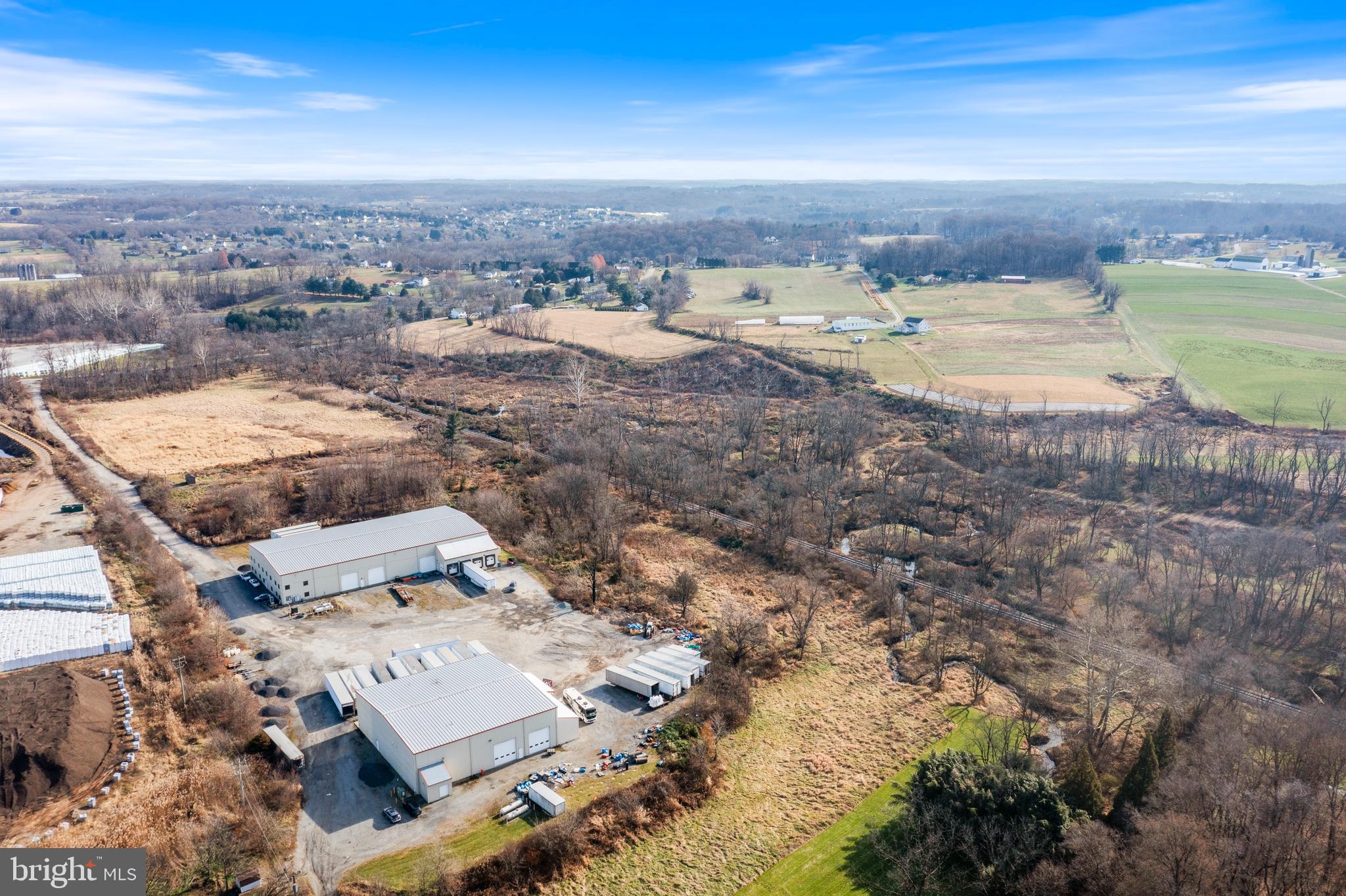 Rare opportunity to purchase warehouse space in Southern Chester County.  This Industrial property consists of 2 large warehouses on 24.4 acres.  Building #1 is 20,000 square feet and has approximately 5,000 square feet of refrigerated storage space, 4 loading bays that are each 16' wide and 5 large at-grade entry doors for convenience.  Building 2 is 10,000 square feet and provides even more flex space for whatever suits with multiple loading bays and at-grade doors for access .  Property is currently rented to a single tenant on a NNN lease that runs until the end of 2024 with an option to renew until 2027.